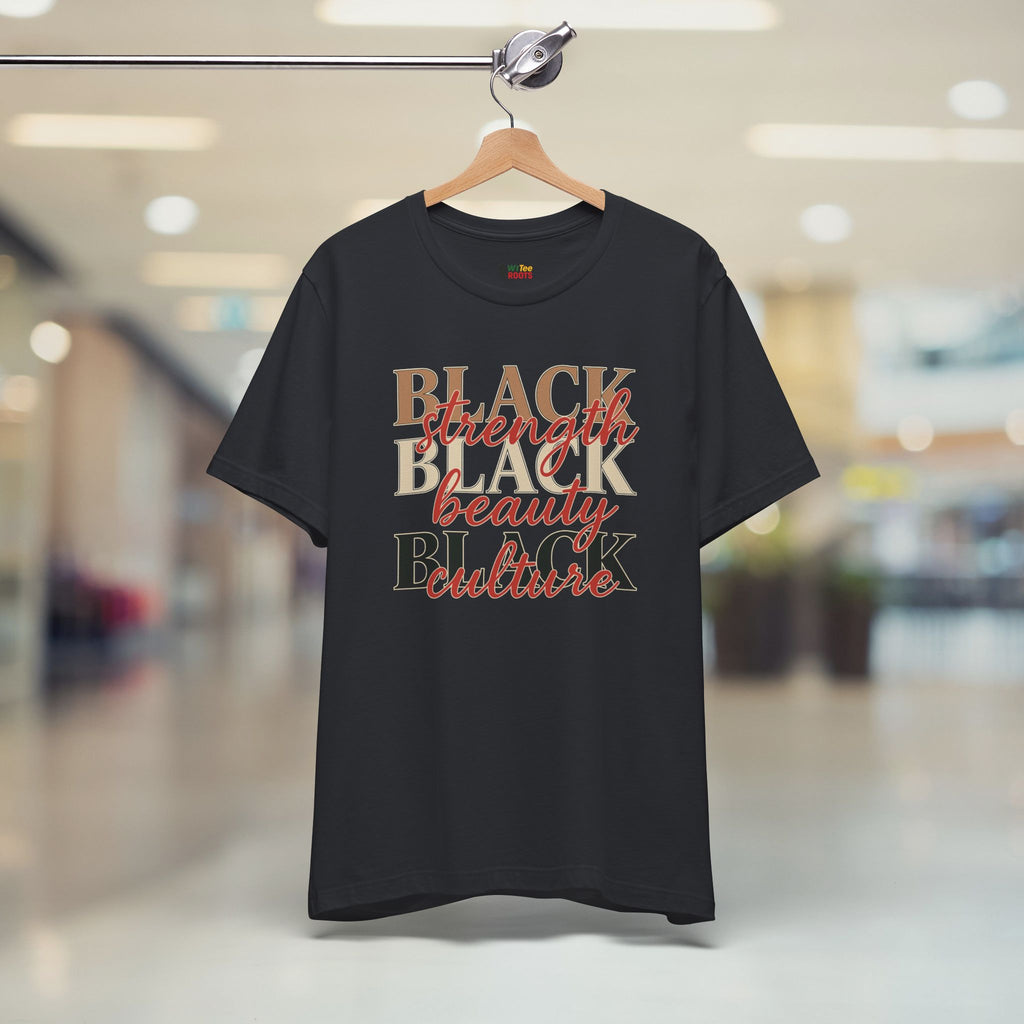 Black t-shirt with 'BLACK strength BLACK beauty culture' text on a hanger in a store.
