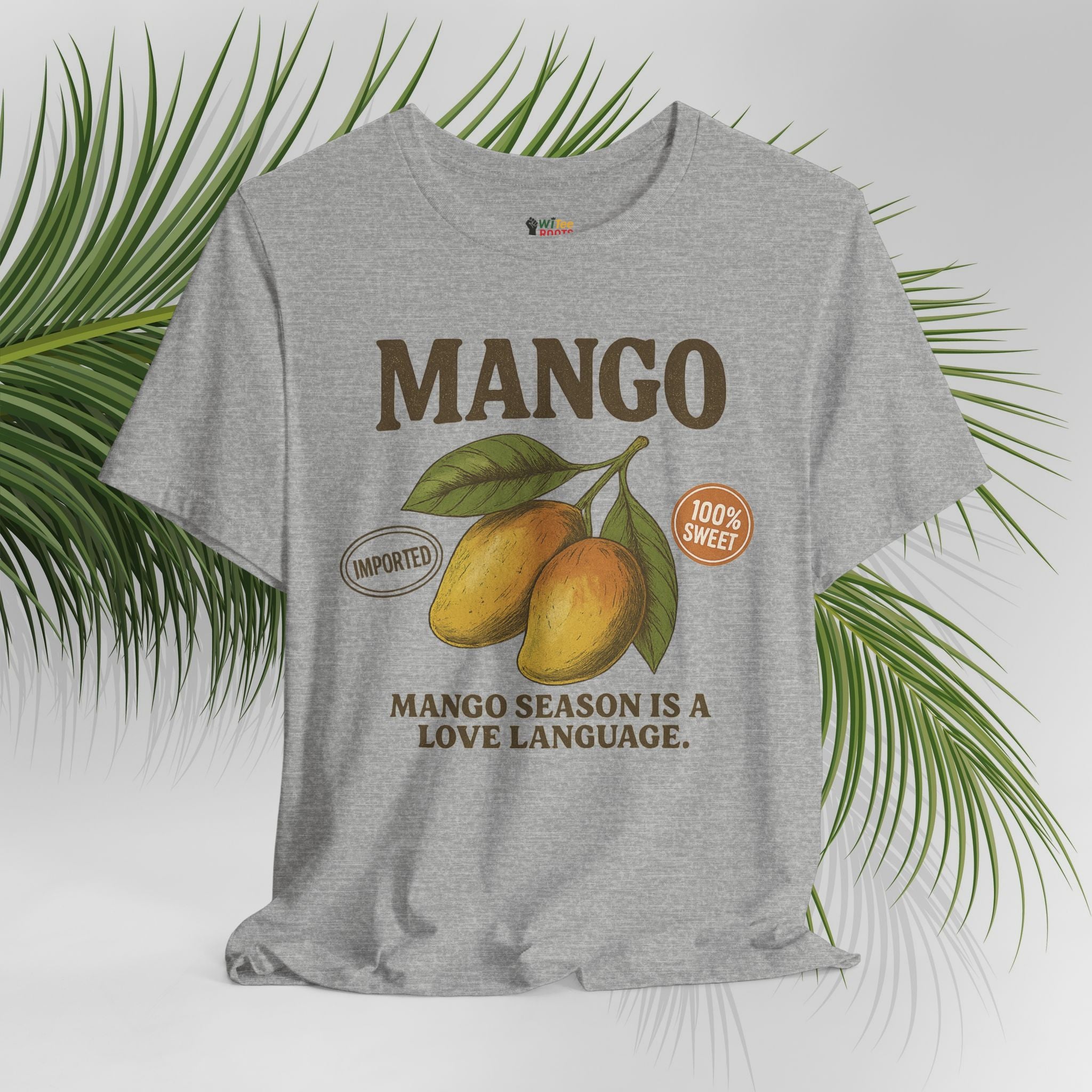 Gray t-shirt with mango graphic and text on a white background with green leaves.