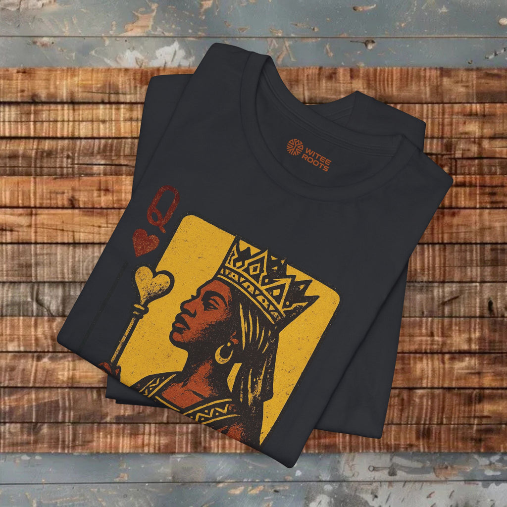 Black t-shirt with a graphic design of a woman's face on a wooden surface