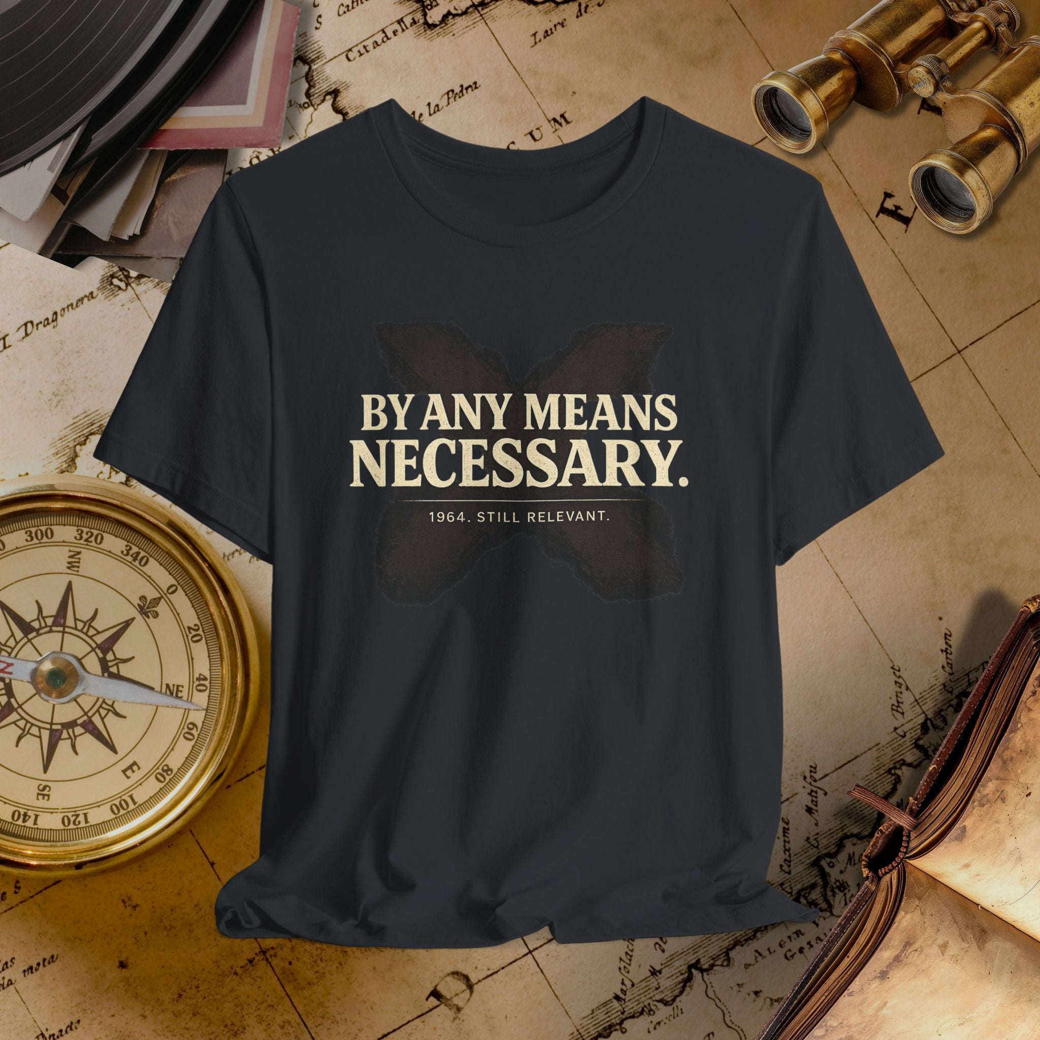 Black t-shirt with 'By Any Means Necessary' text on a vintage map background
