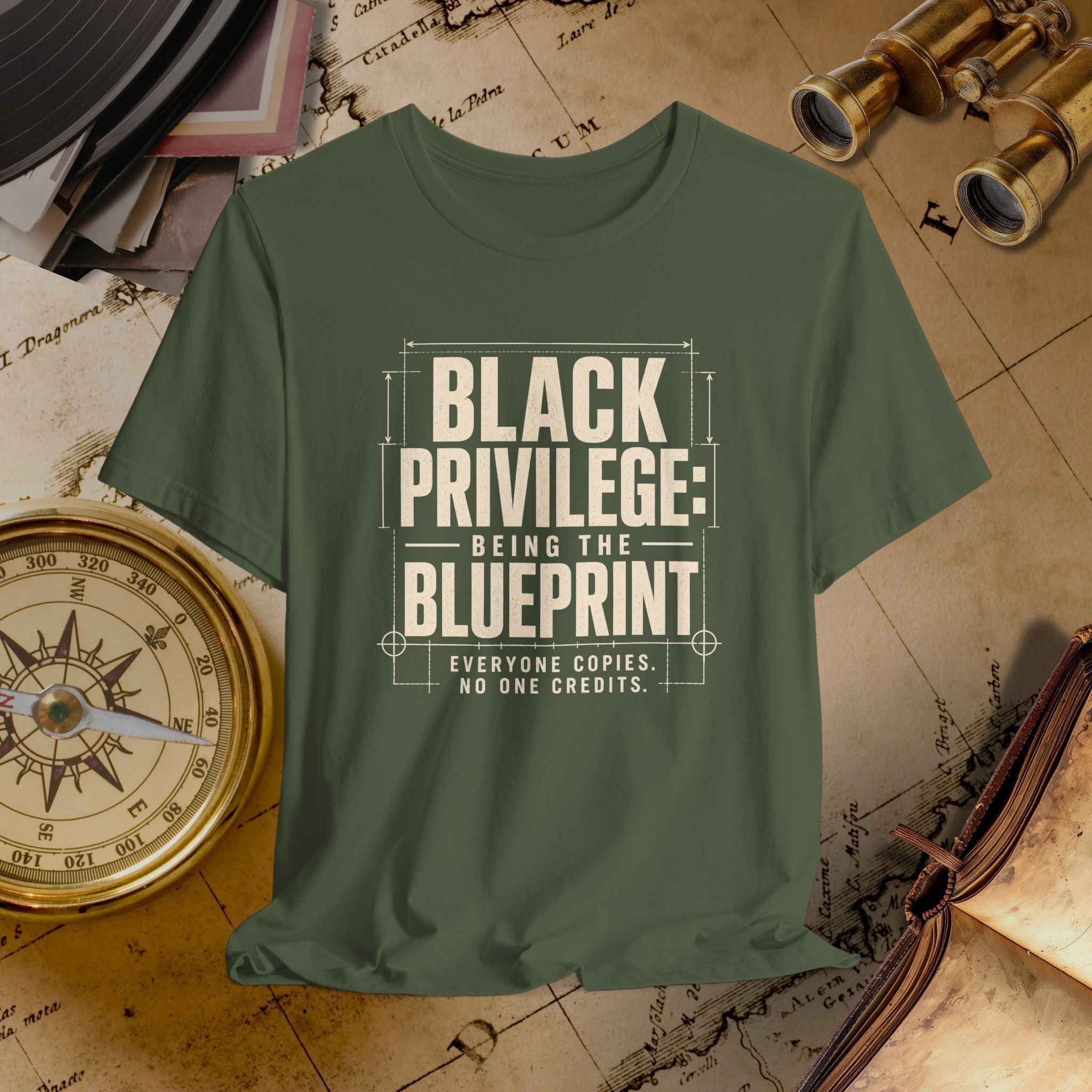 Green t-shirt with 'Black Privilege: Being the Blueprint' text on a vintage map background