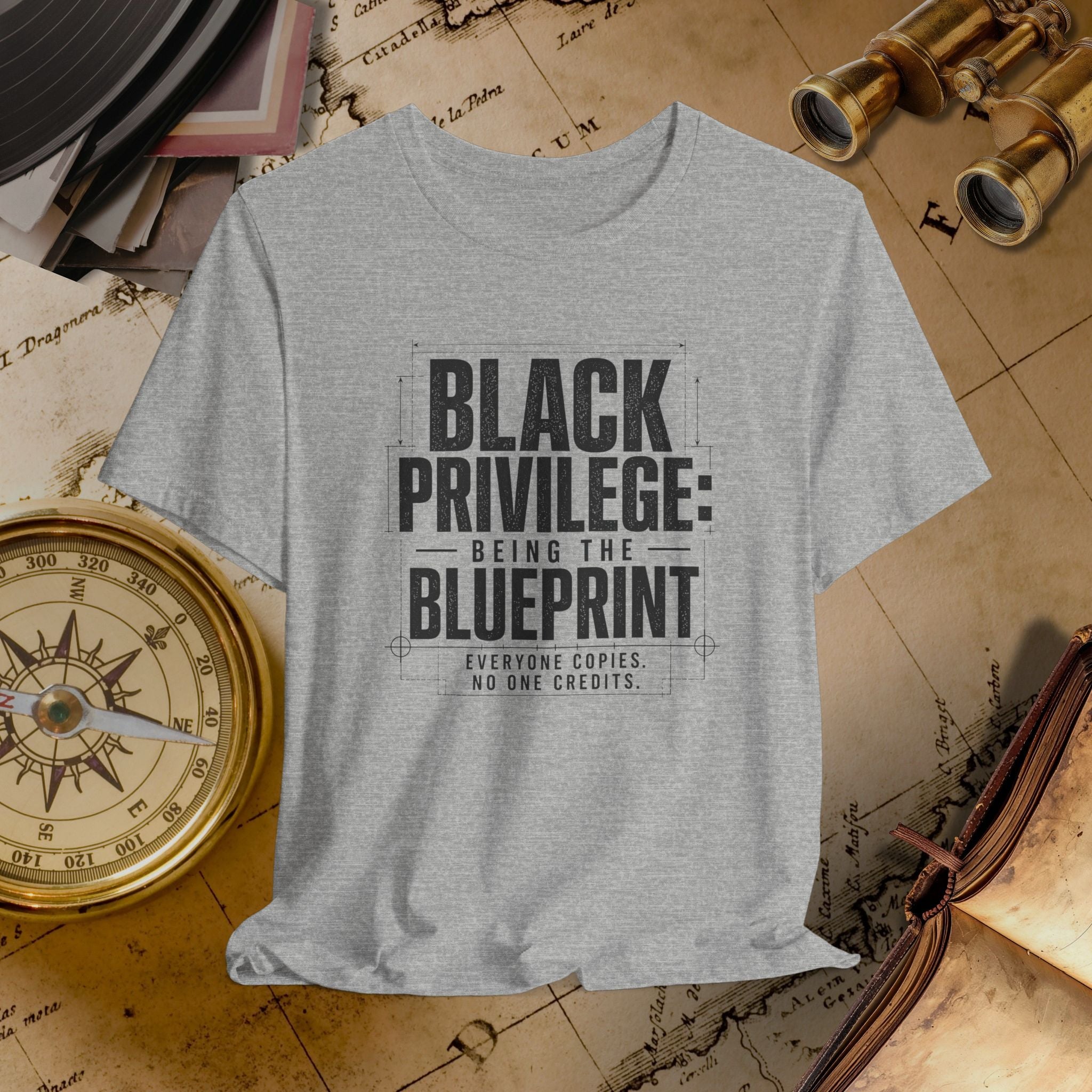 Grey t-shirt with 'Black Privilege: Being the Blueprint' text on a vintage map background