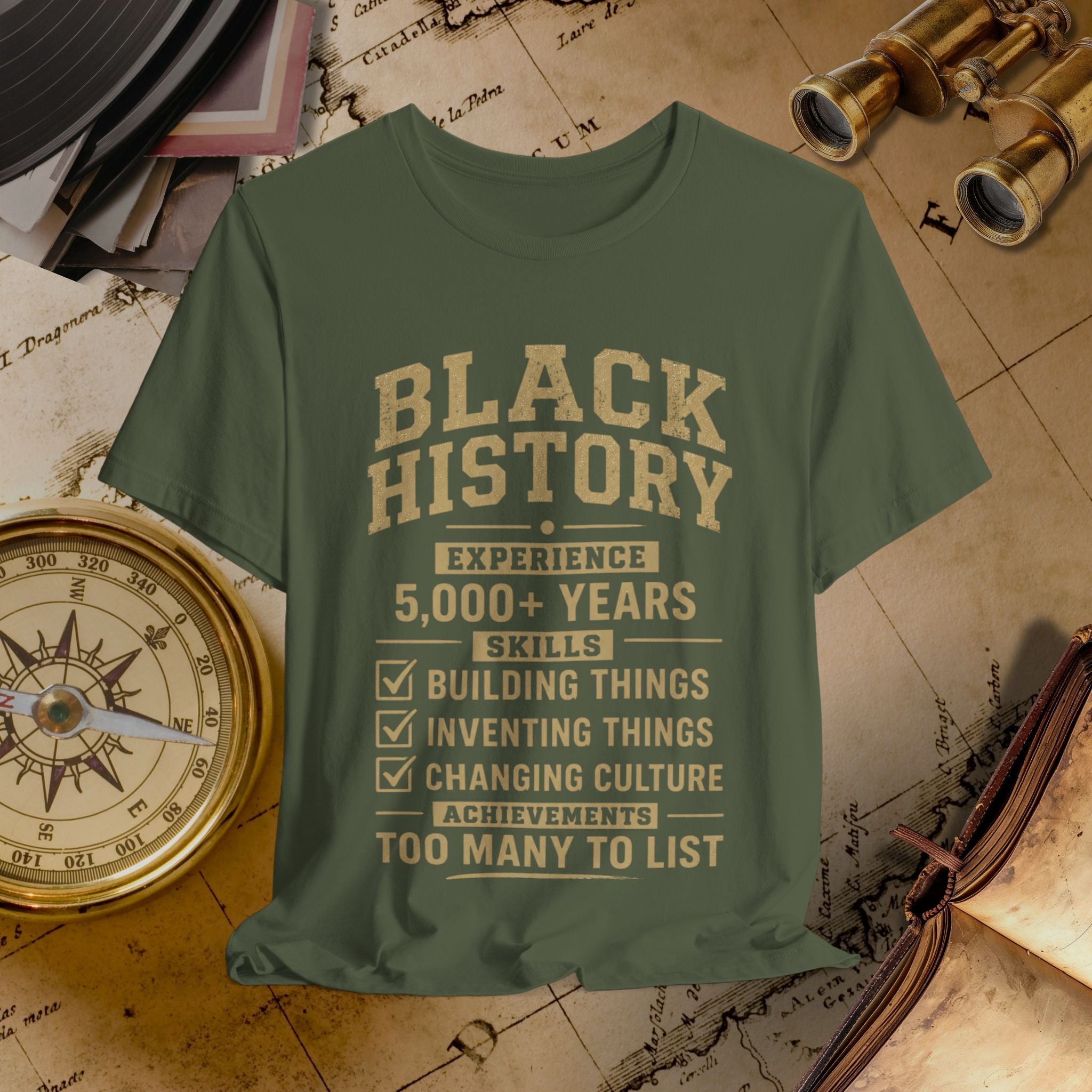 Green t-shirt with 'Black History' text on a vintage map background