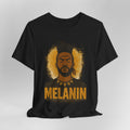 Black t-shirt with a graphic of a man's face and the word 'Melanin' on a gray background