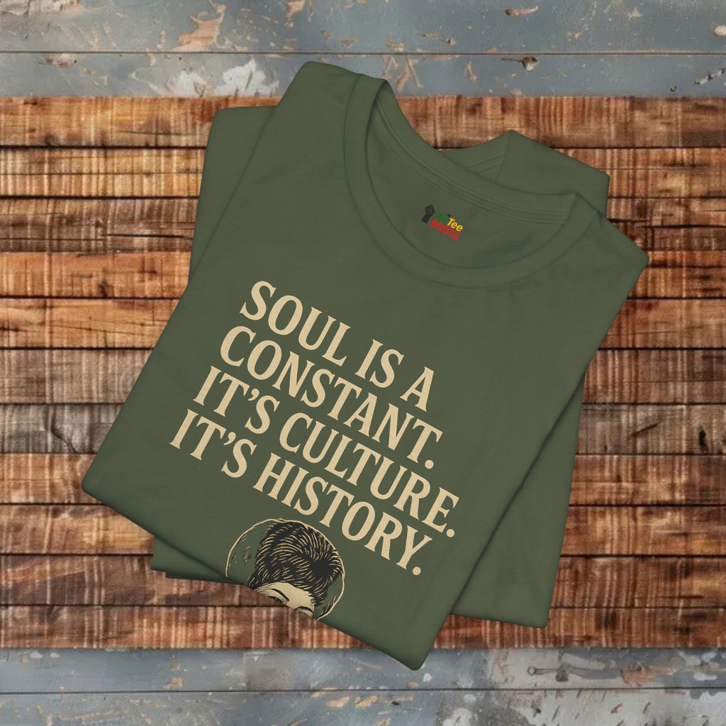 Green t-shirt with text on a wooden surface