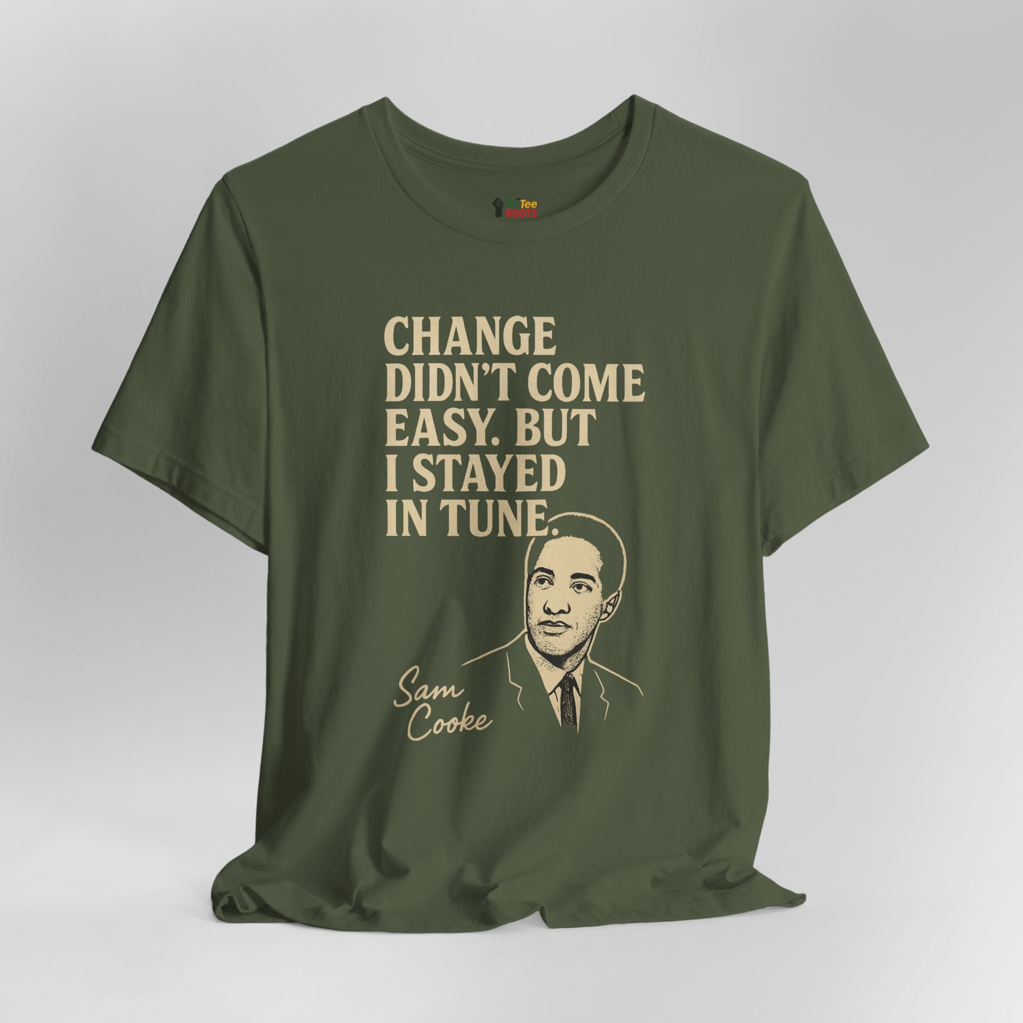 Green t-shirt with text and a portrait on a gray background