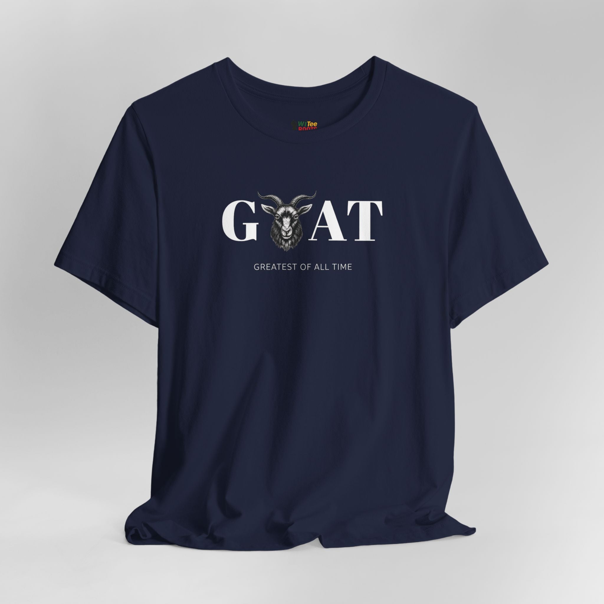 Navy blue t-shirt with 'Greatest of All Time' text and goat graphic on a gray background