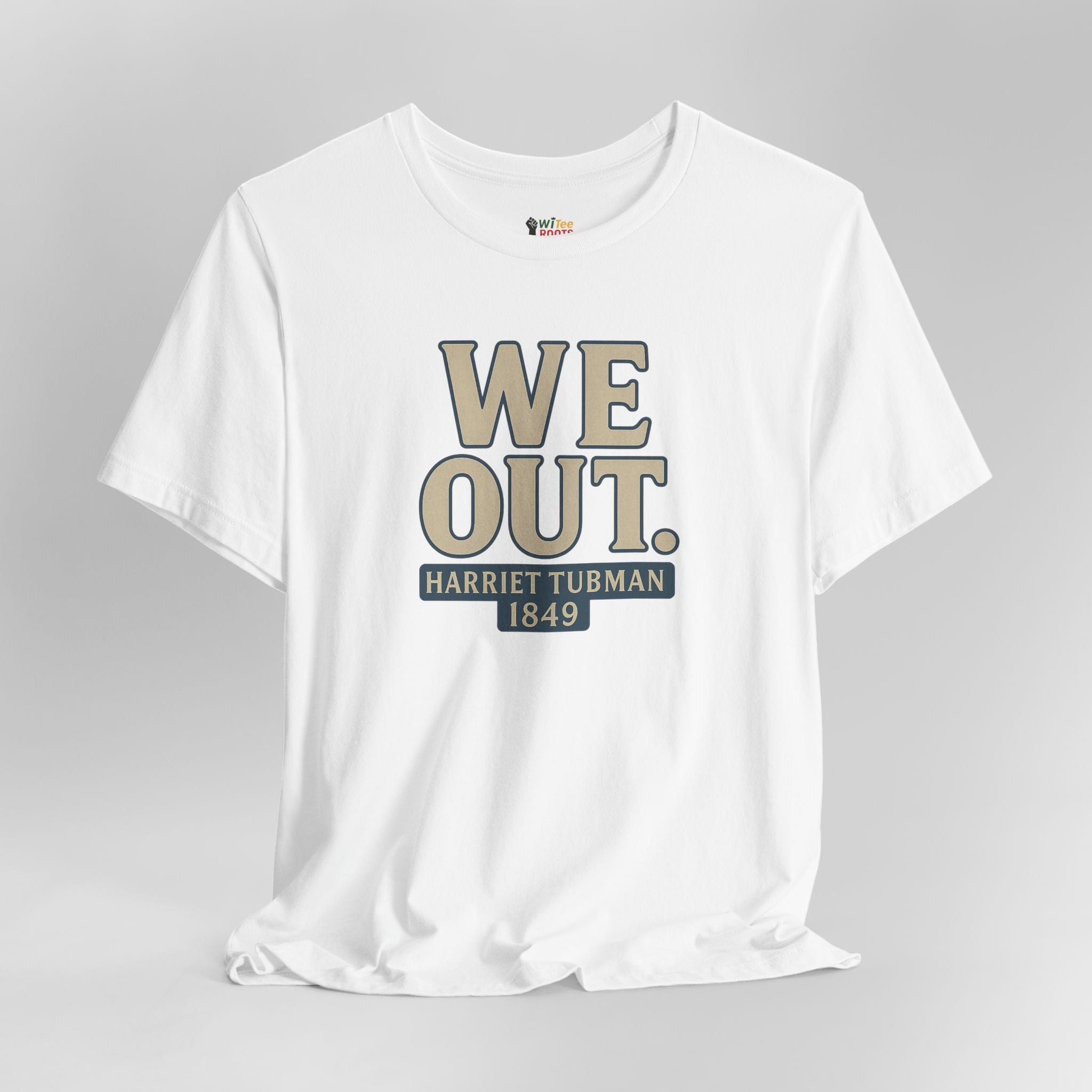 White t-shirt with 'WE OUT. HARRIET TUBMAN 1849' text on a gray background
