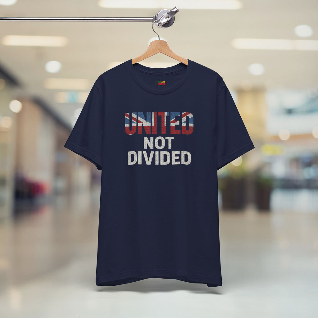 Navy blue t-shirt with 'UNITED NOT DIVIDED' text on a hanger in a blurred indoor setting
