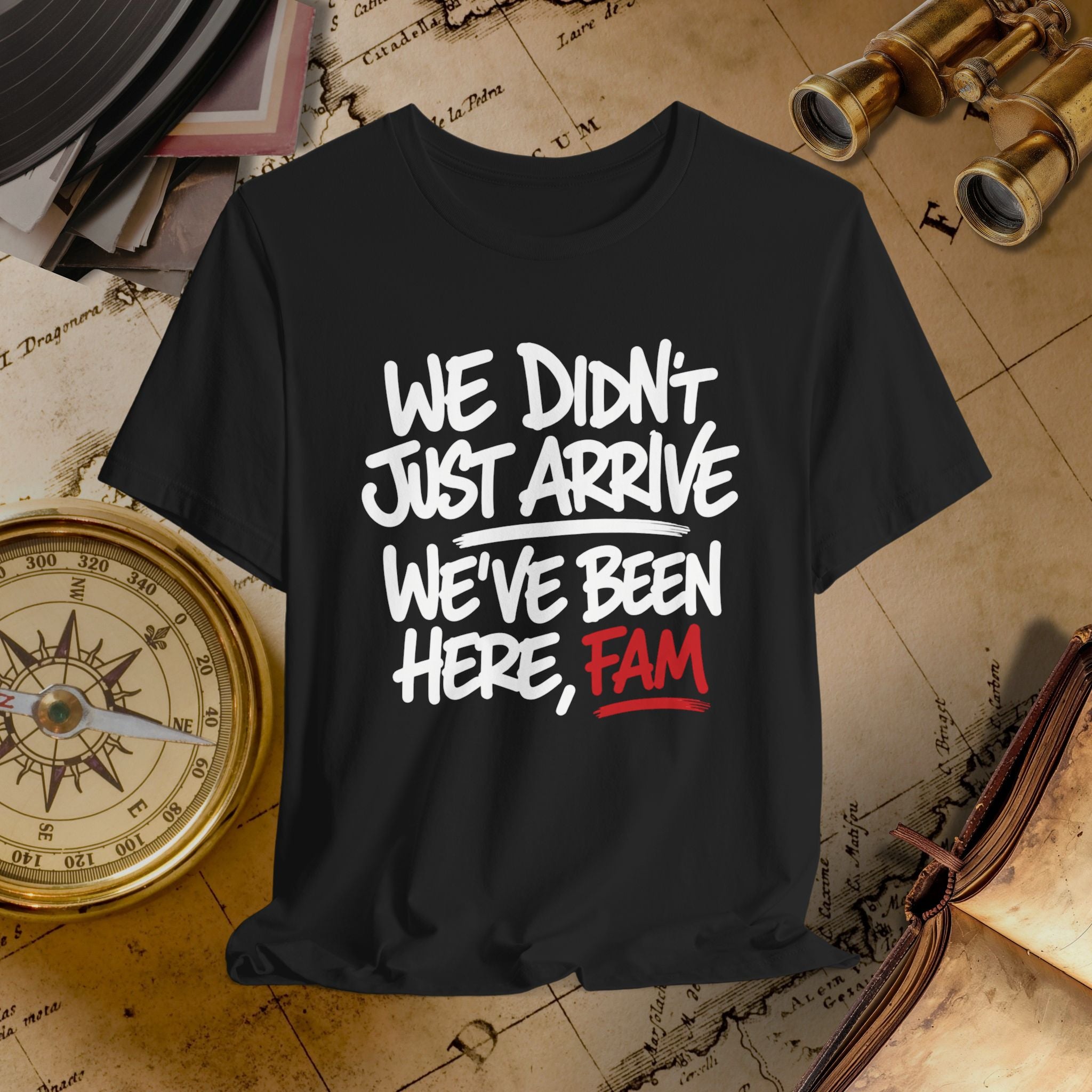 Black t-shirt with white and red text on a vintage map background