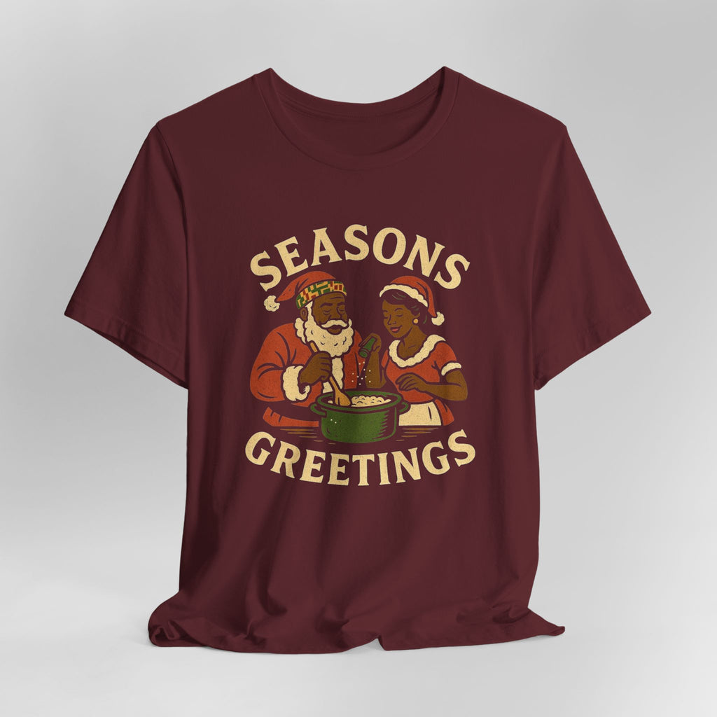 Maroon t-shirt with 'Seasons Greetings' graphic on a white background