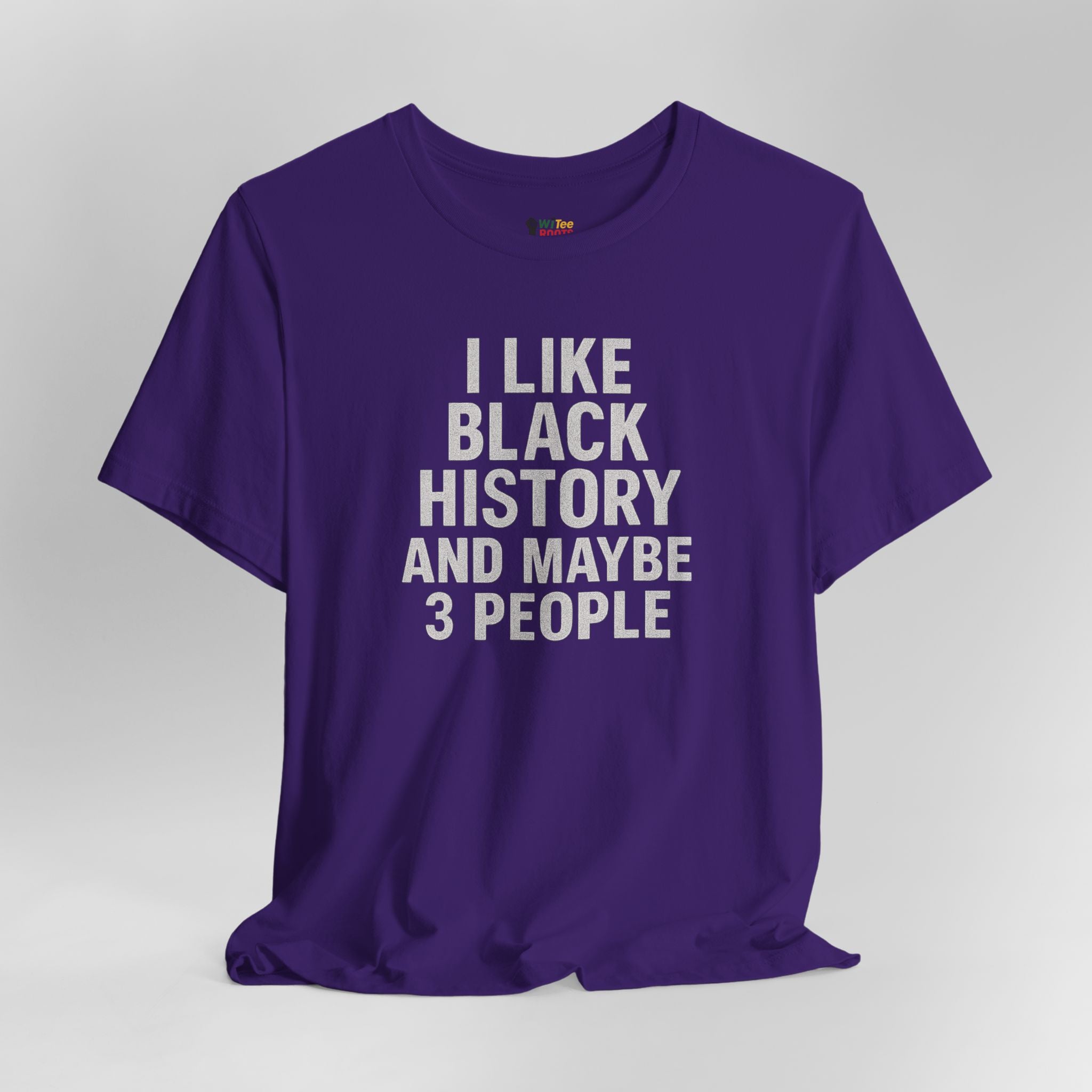 Purple t-shirt with white text on a gray background