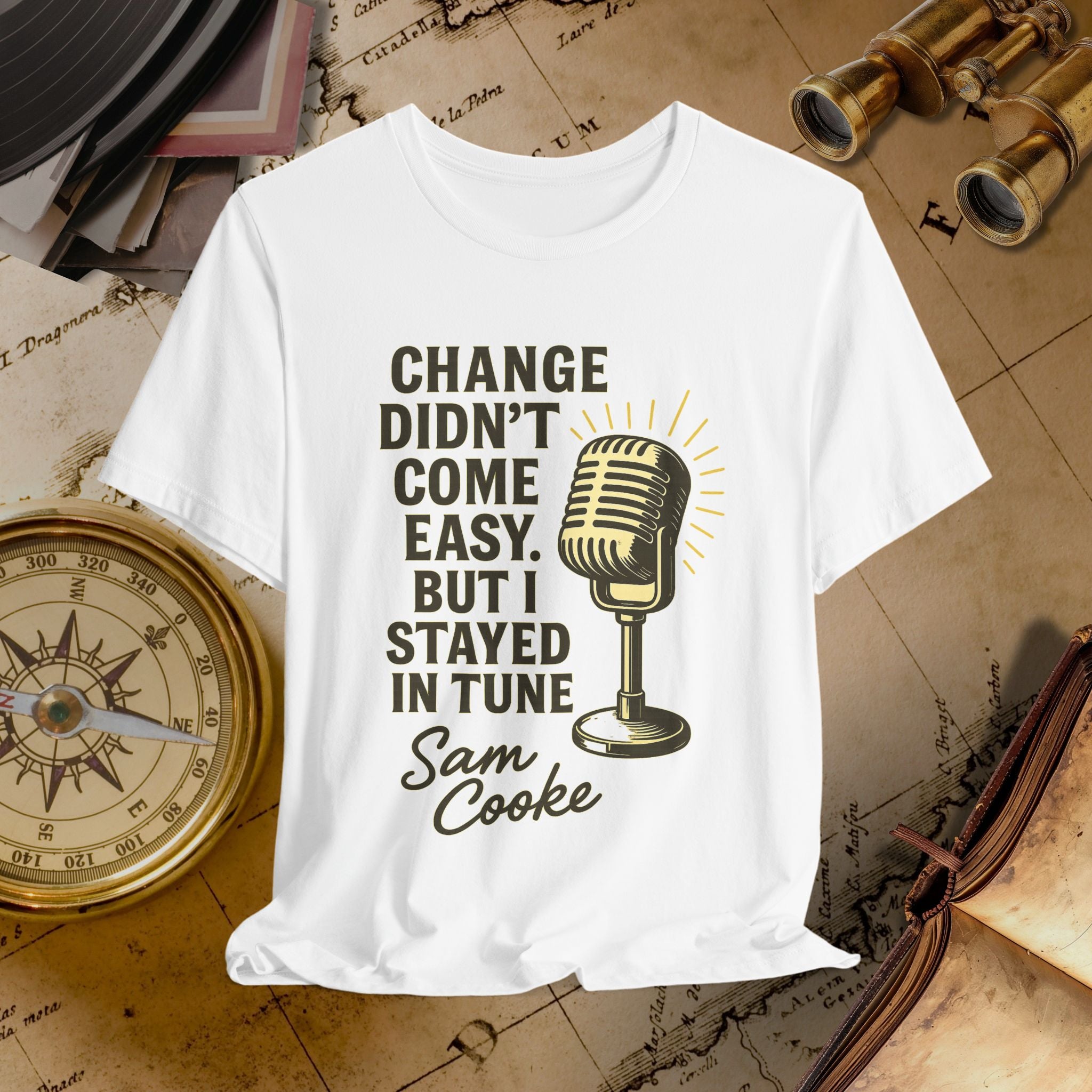 White t-shirt with microphone graphic and text on a vintage map background