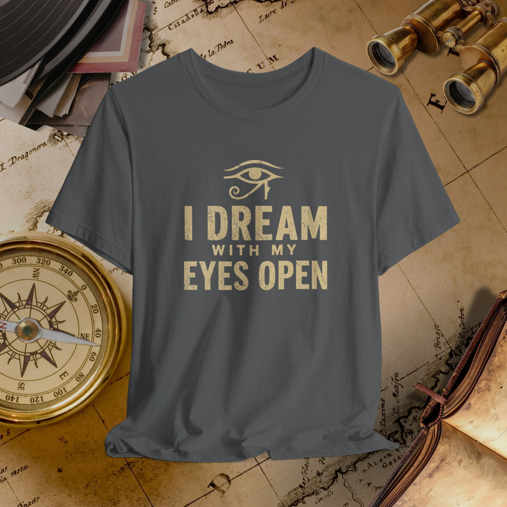 Gray t-shirt with 'I Dream with My Eyes Open' text and eye symbol on a vintage map background.