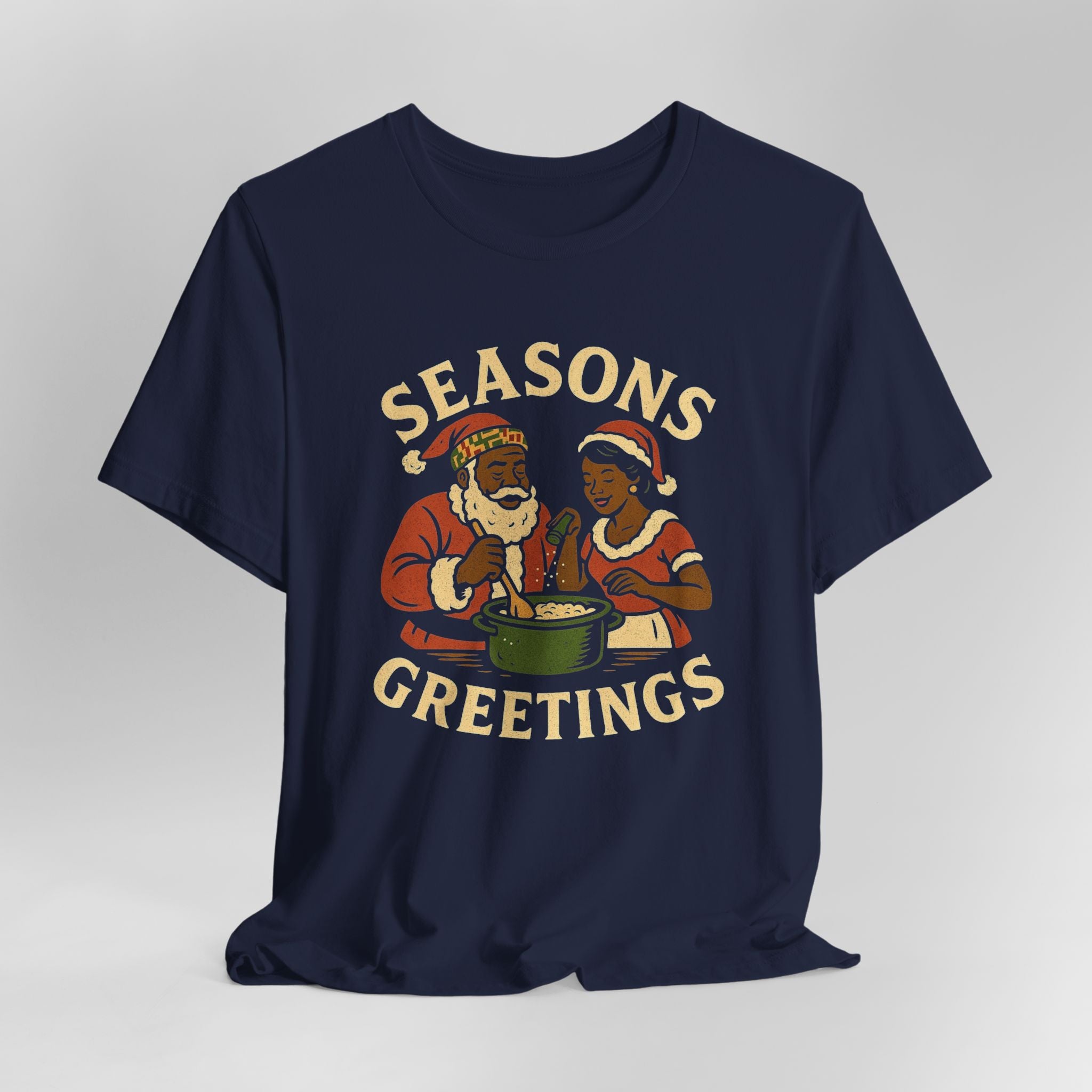 Navy blue t-shirt with 'Seasons Greetings' graphic on a light gray background