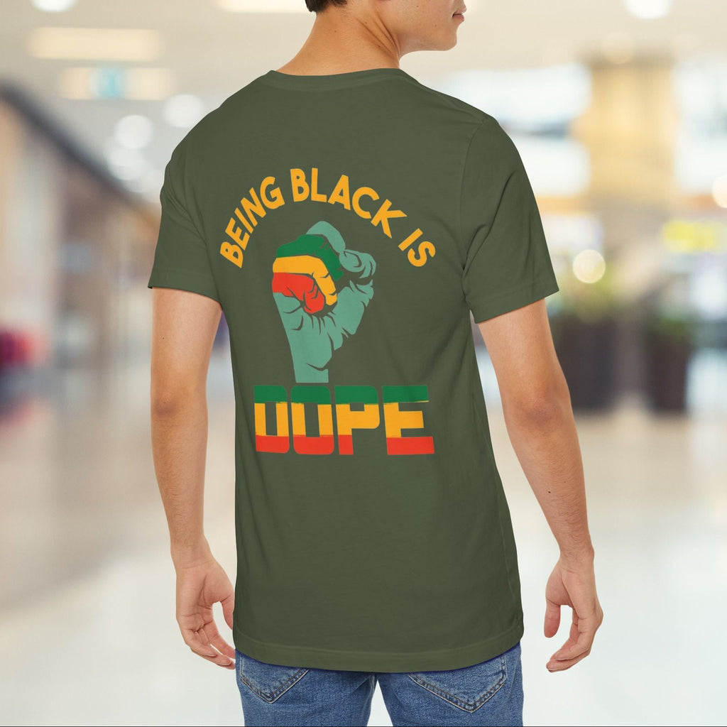 Person wearing a green t-shirt with a message on the back in an indoor setting