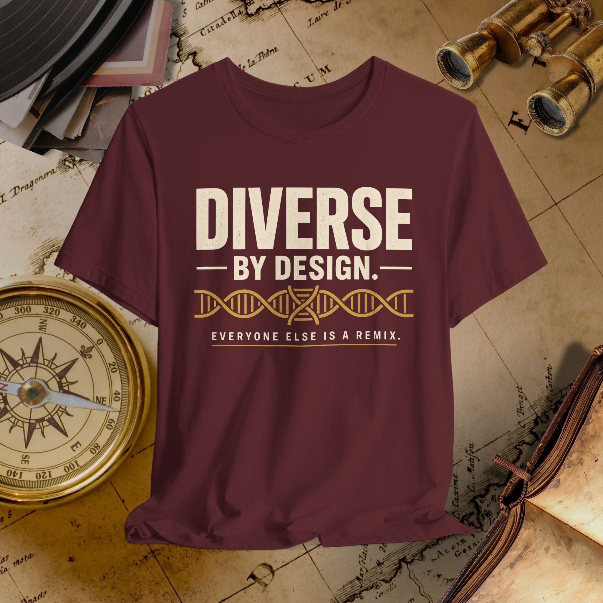 Maroon t-shirt with 'Diverse by Design' text on a vintage map background