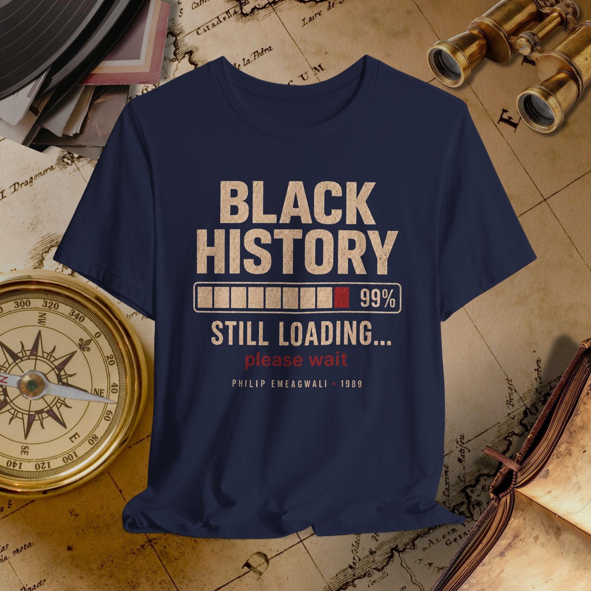 Navy blue t-shirt with 'Black History Still Loading' text on a vintage map background
