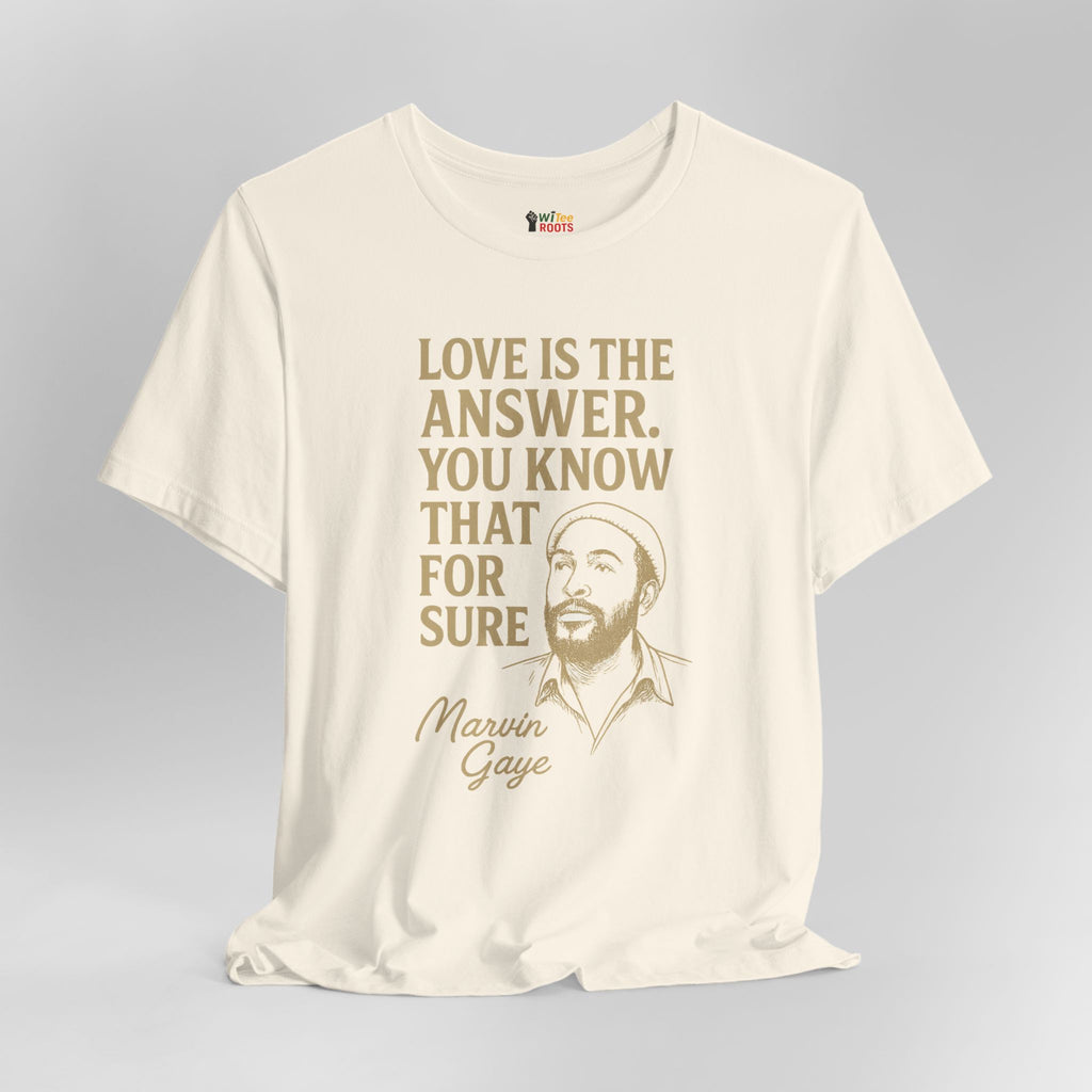 Beige t-shirt with gold text and a graphic of Marvin Gaye on a gray background