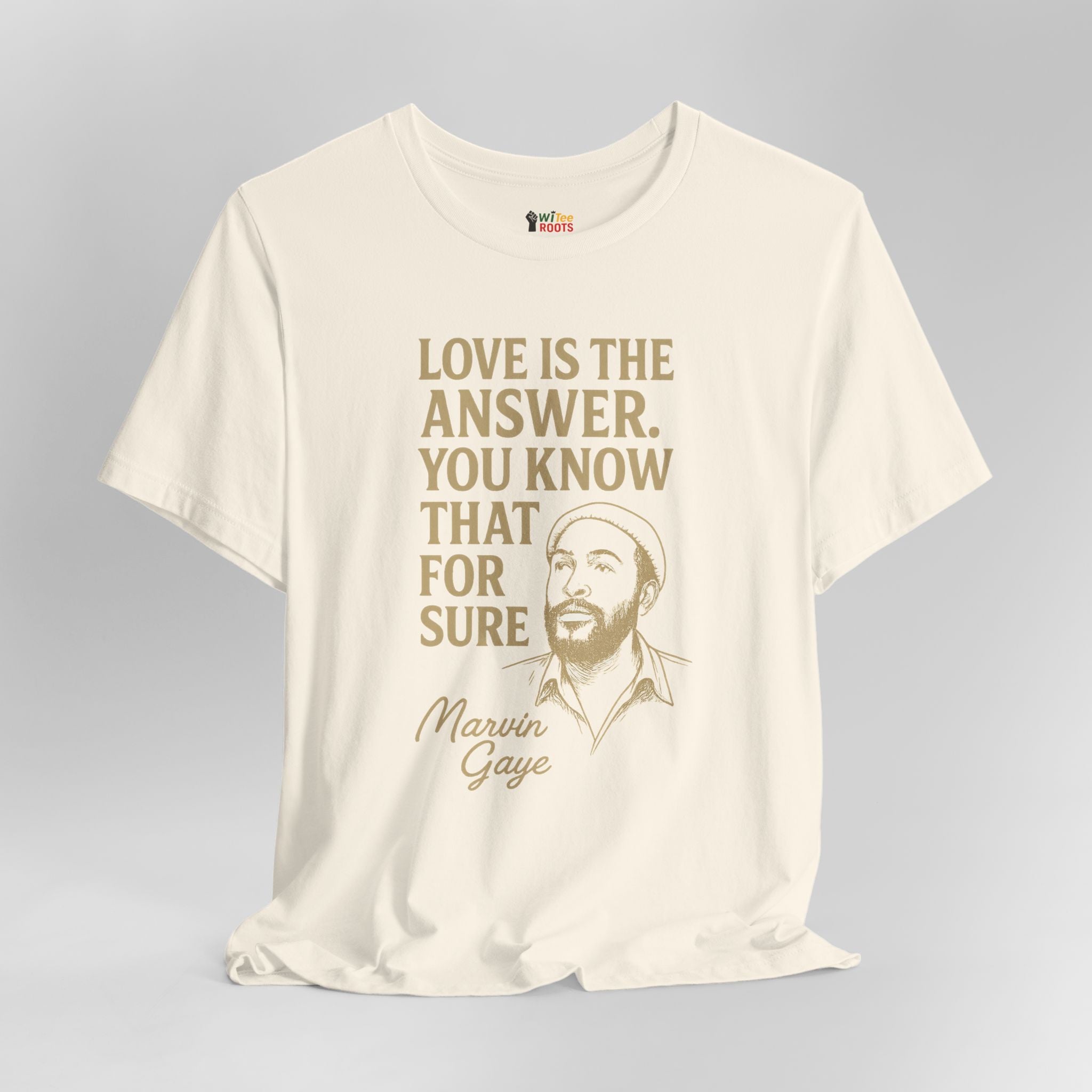 Beige t-shirt with gold text and a graphic of Marvin Gaye on a gray background