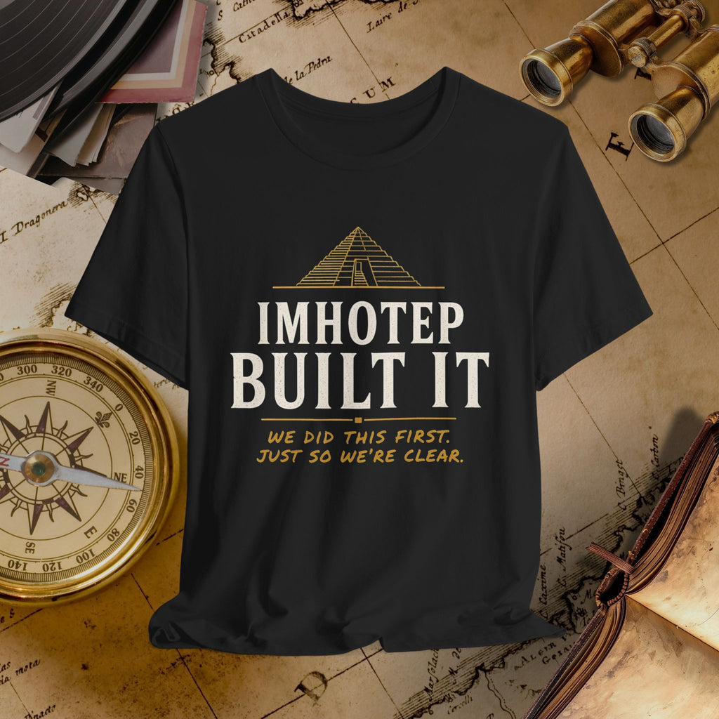Black t-shirt with 'IMHOTEP BUILT IT' text on a vintage background with books and compasses.