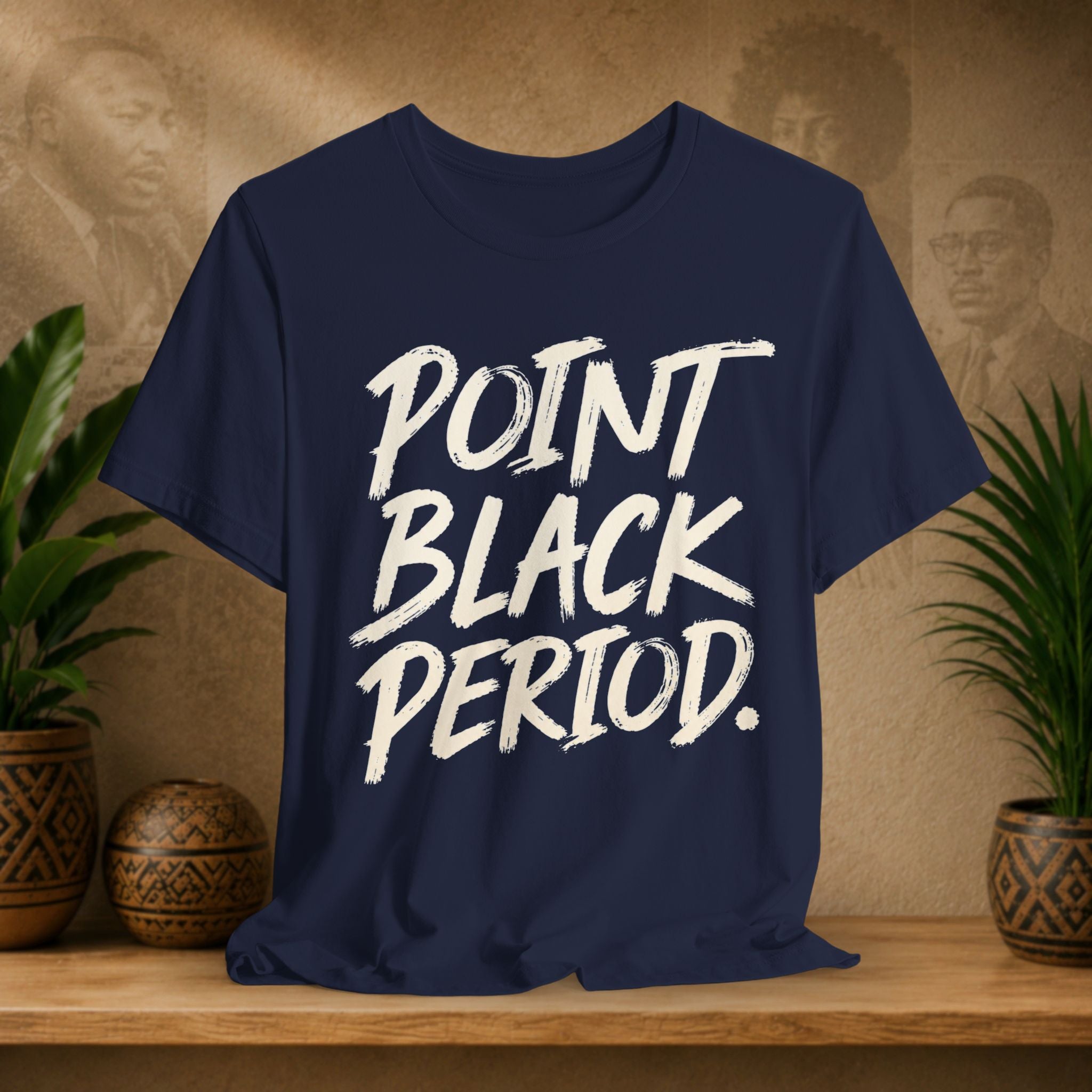 A navy blue short-sleeve t-shirt with the phrase 'POINT BLACK PERIOD.' printed in a large, white brush-stroke style font across the chest.
