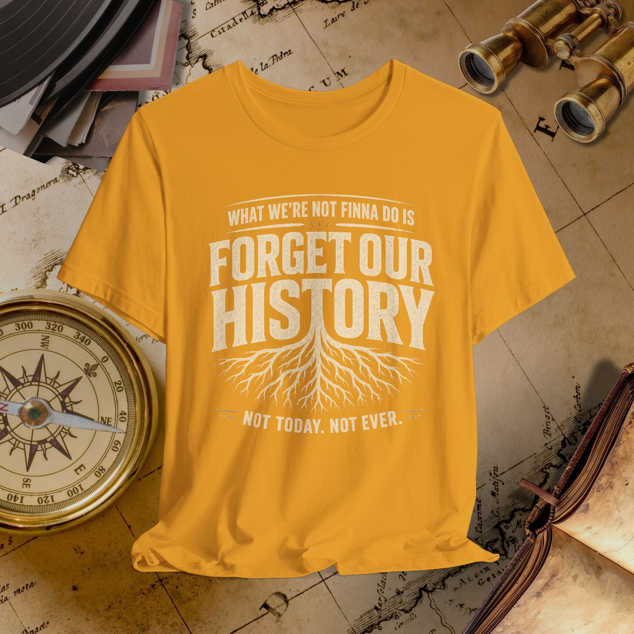 Mustard t-shirt with 'Forget Our History' text on a vintage map background