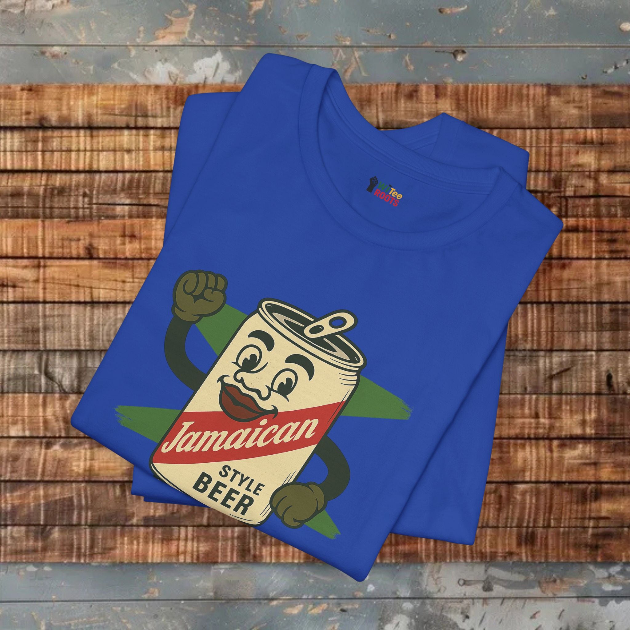 Blue t-shirt with a Jamaican-style beer can graphic on a wooden surface