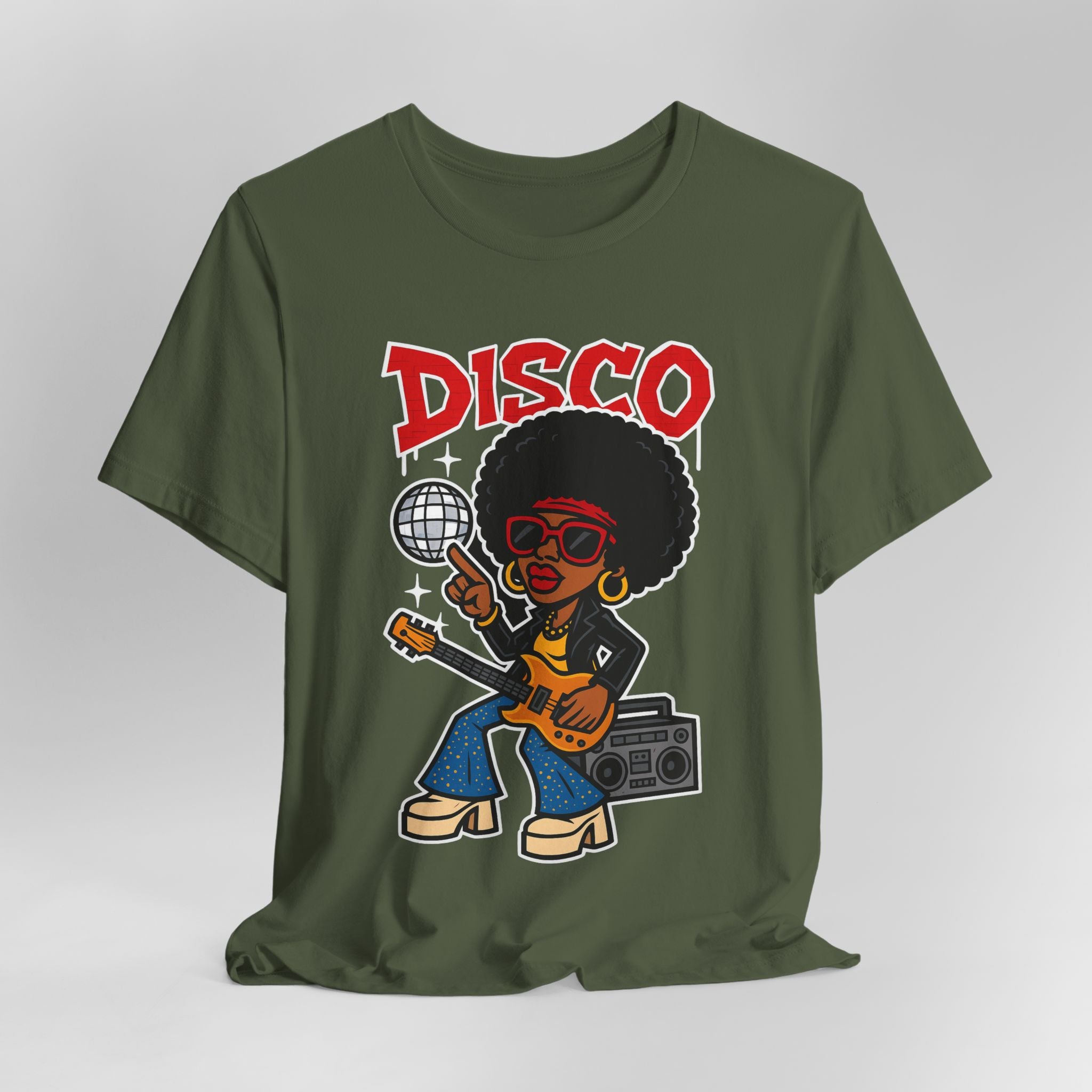 Green t-shirt with a cartoon character holding a boombox and disco ball, with 'DISCO' text above on a white background.