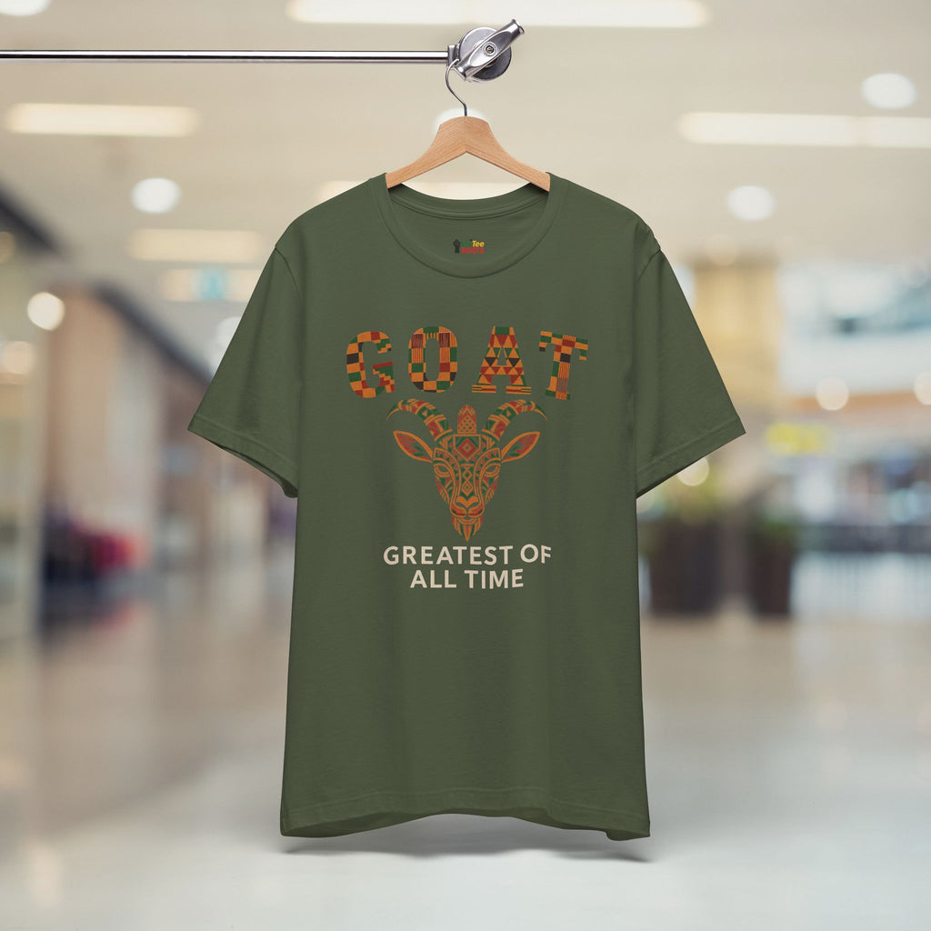 Green t-shirt with a giraffe graphic and text on a hanger in a store setting