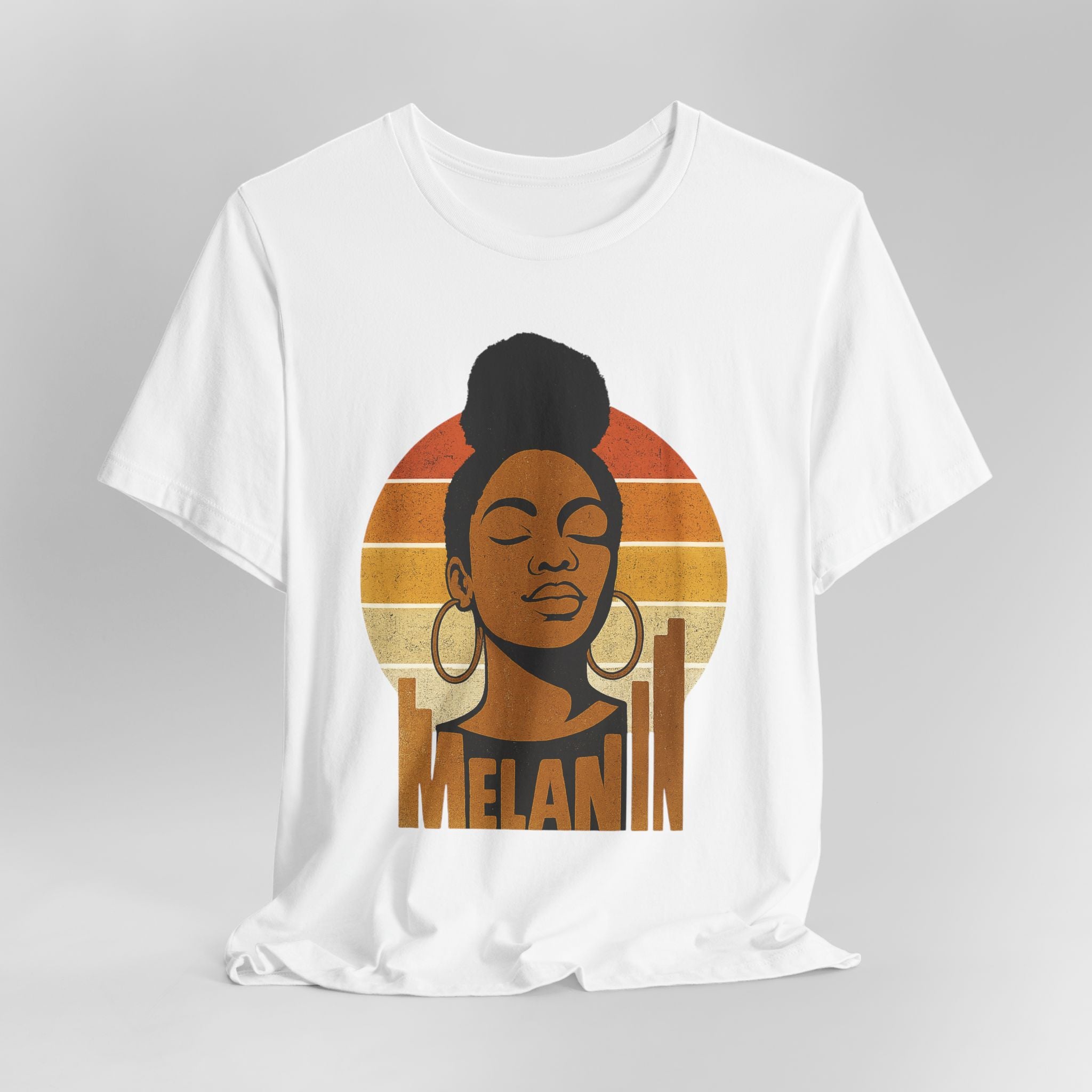 White t-shirt with a graphic of a woman's face and 'Melanin' text on a gray background