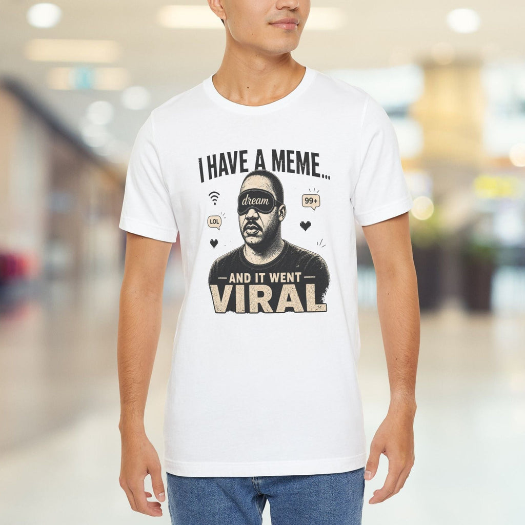 Man wearing a white t-shirt with a graphic design and text in a mall.