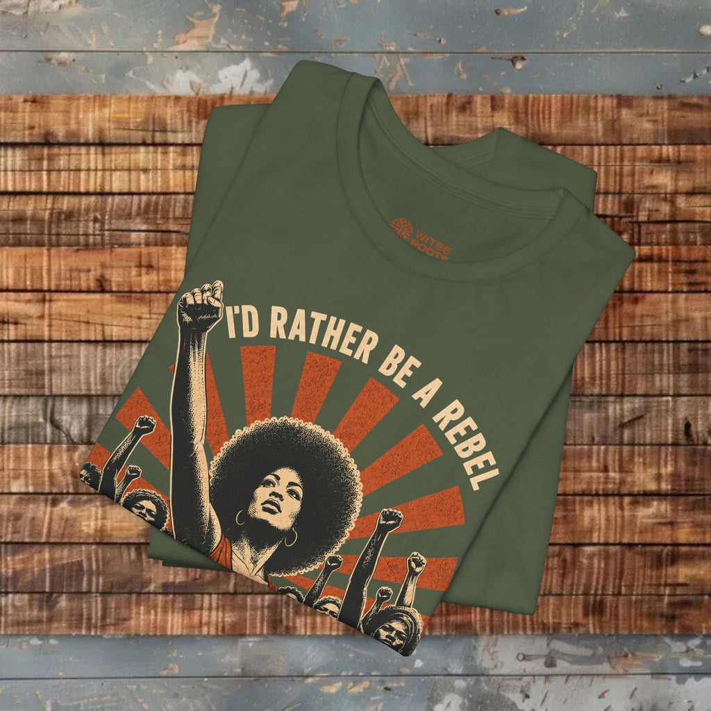 Green t-shirt with graphic design and text on a wooden surface