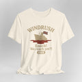 Beige t-shirt with 'Windrush' graphic and text on a gray background