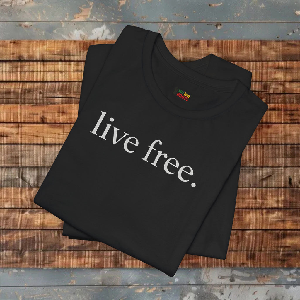 Black ts-hirt with 'live free' printed on it, folded on a wooden surface