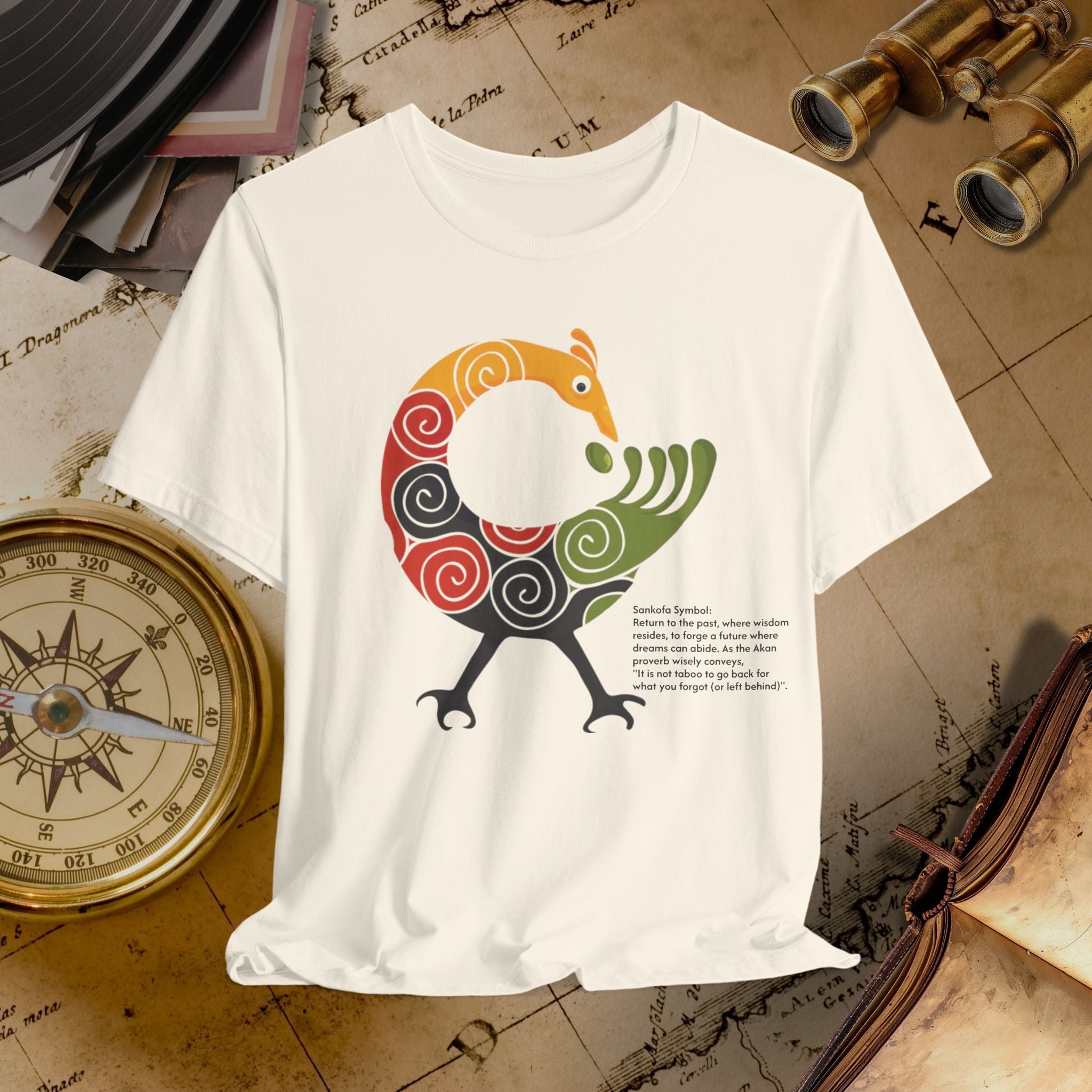 Beige t-shirt with a colorful bird design on a vintage map background