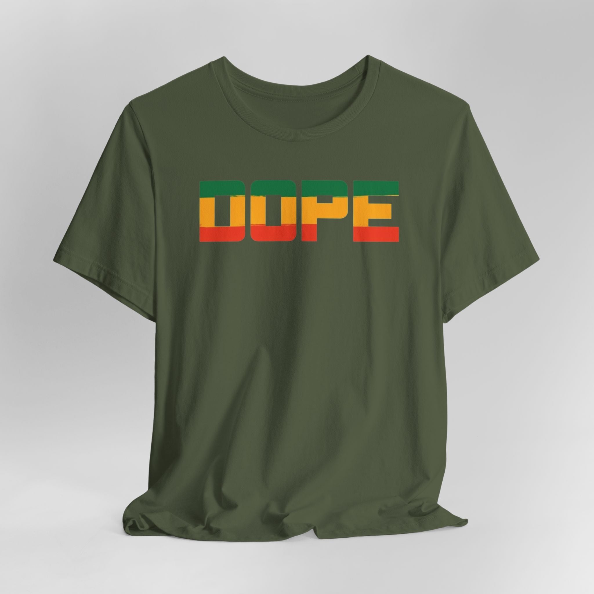 Green t-shirt with 'DUPE' text in colorful letters on a gray background