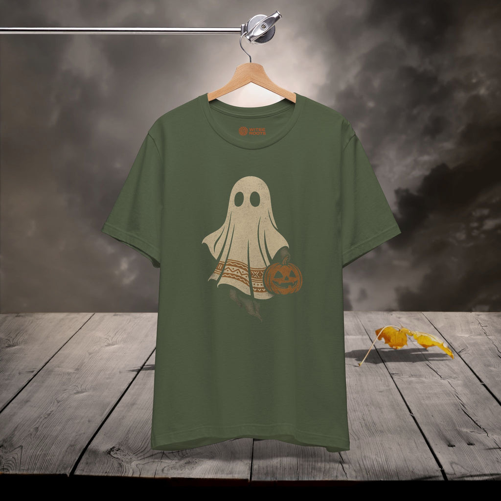 Green t-shirt with a ghost design on a wooden surface with a dark background