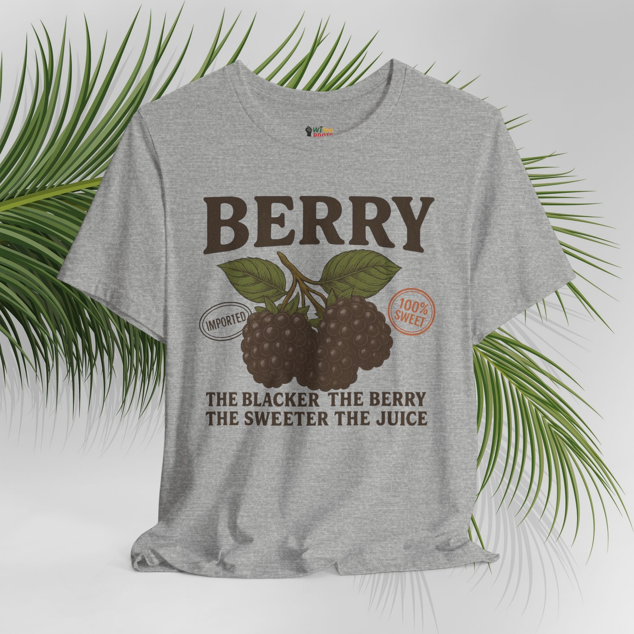 Gray t-shirt with berry graphic and text on a white background with green leaves.