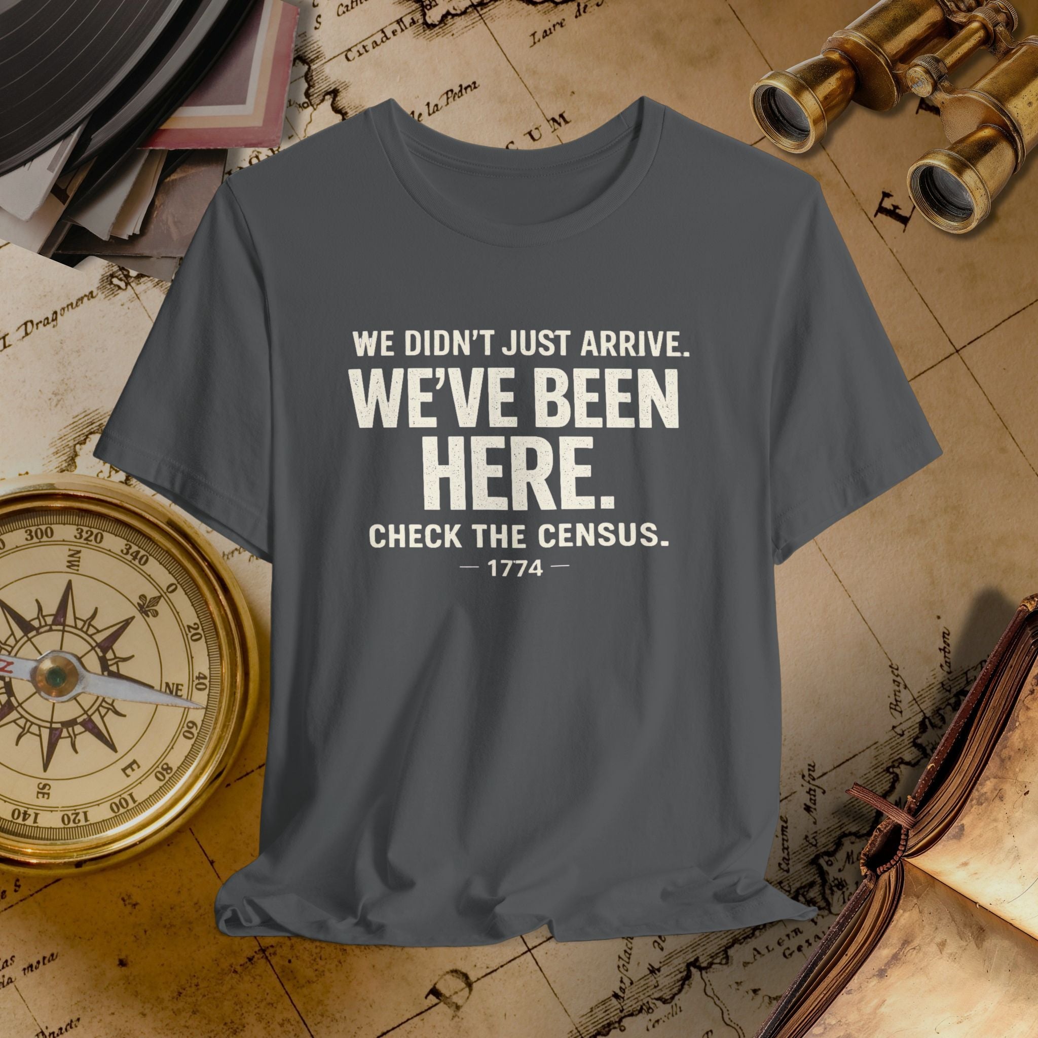 Green t-shirt with humorous text on a vintage map background