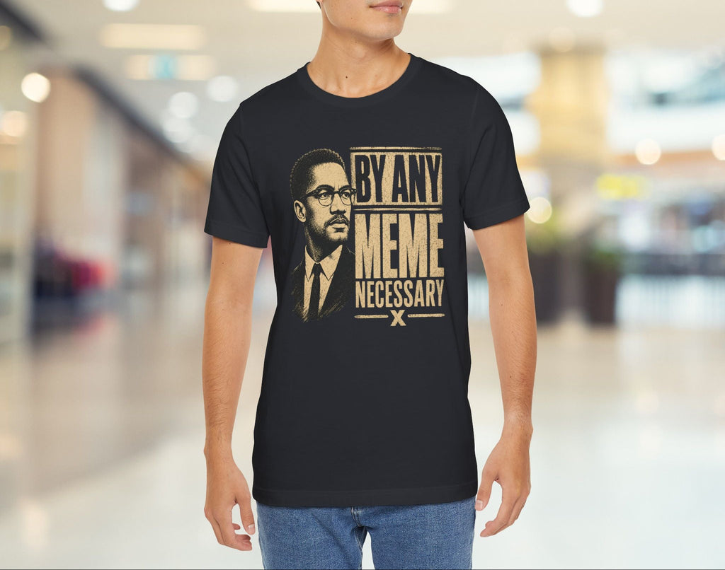 Person wearing a black t-shirt with a graphic design and text in a mall.