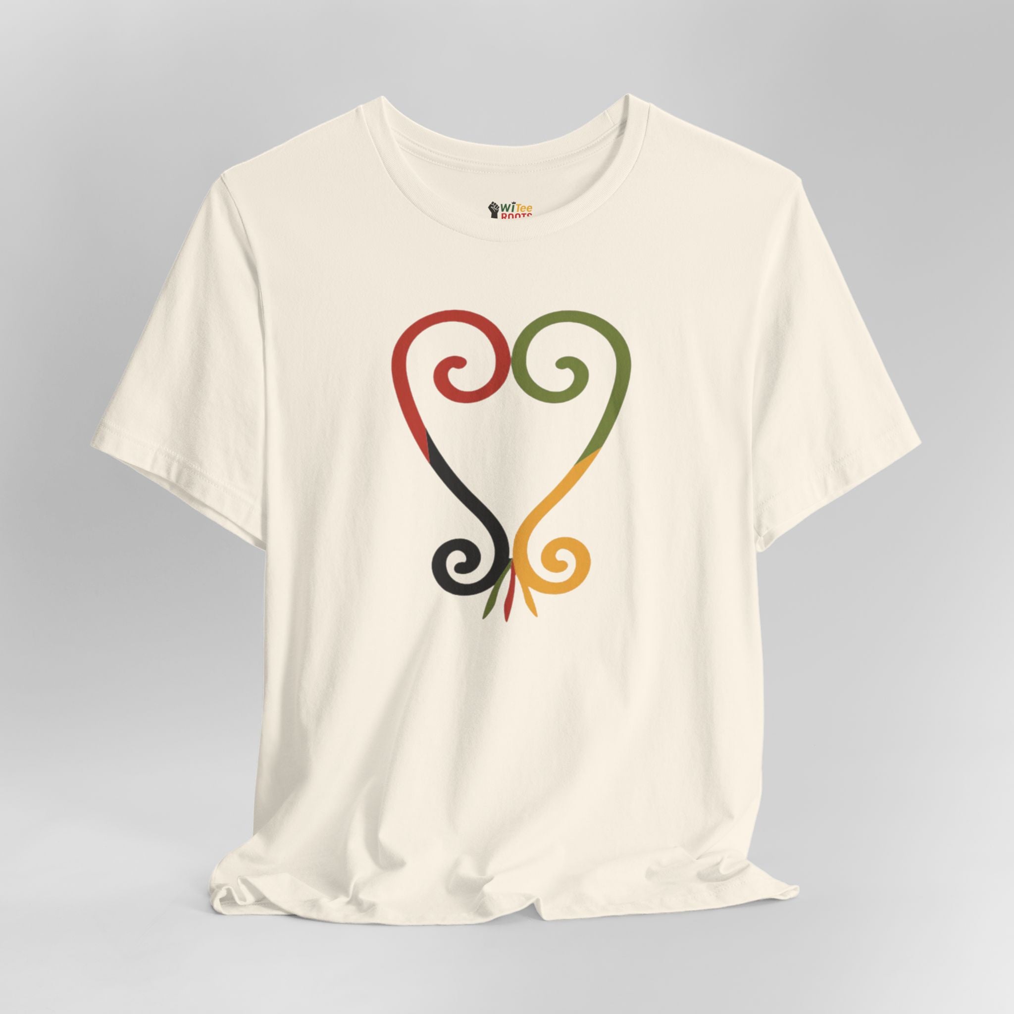 Cream t-shirt with colorful abstract design on a gray background