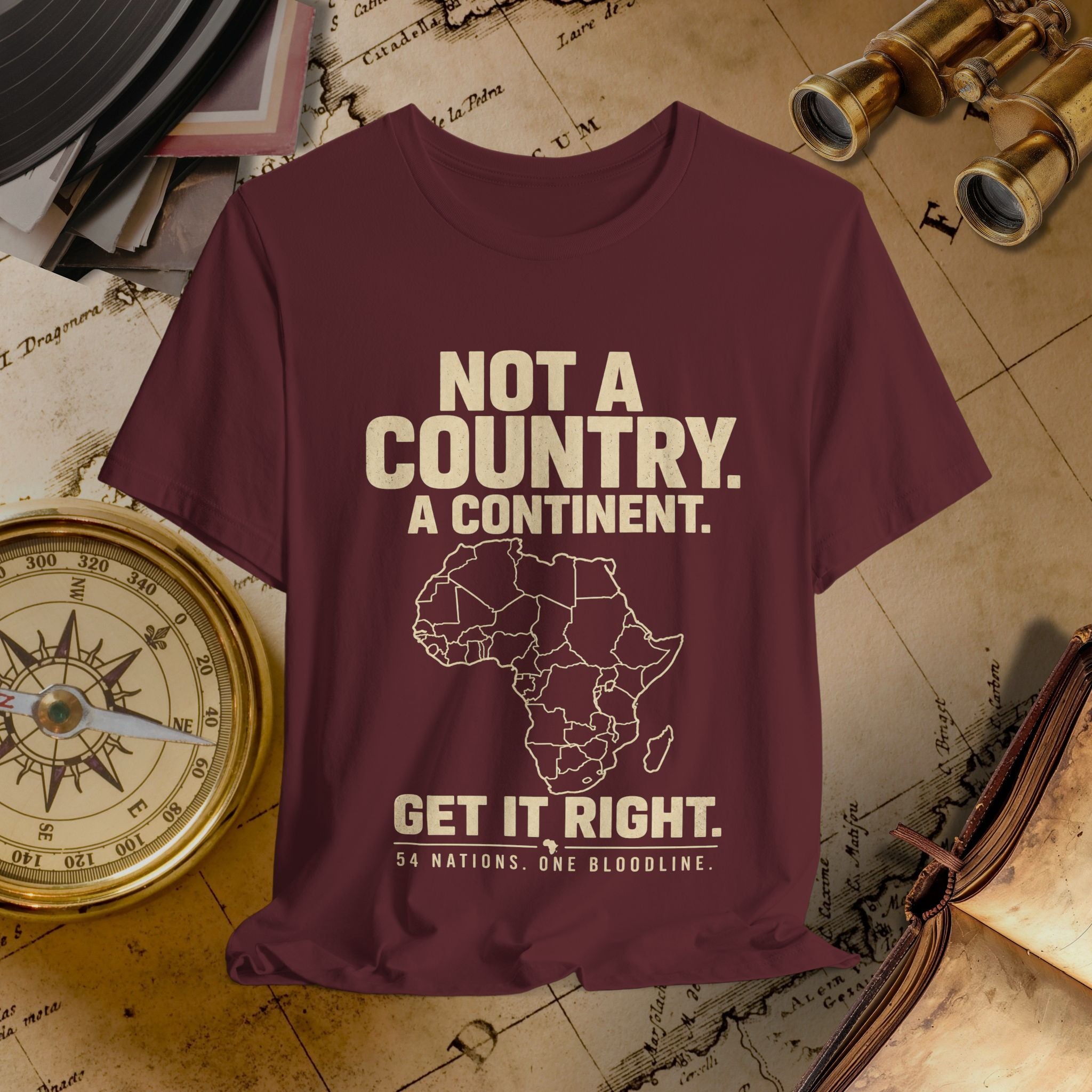 Maroon t-shirt with Africa map and text on a vintage map background