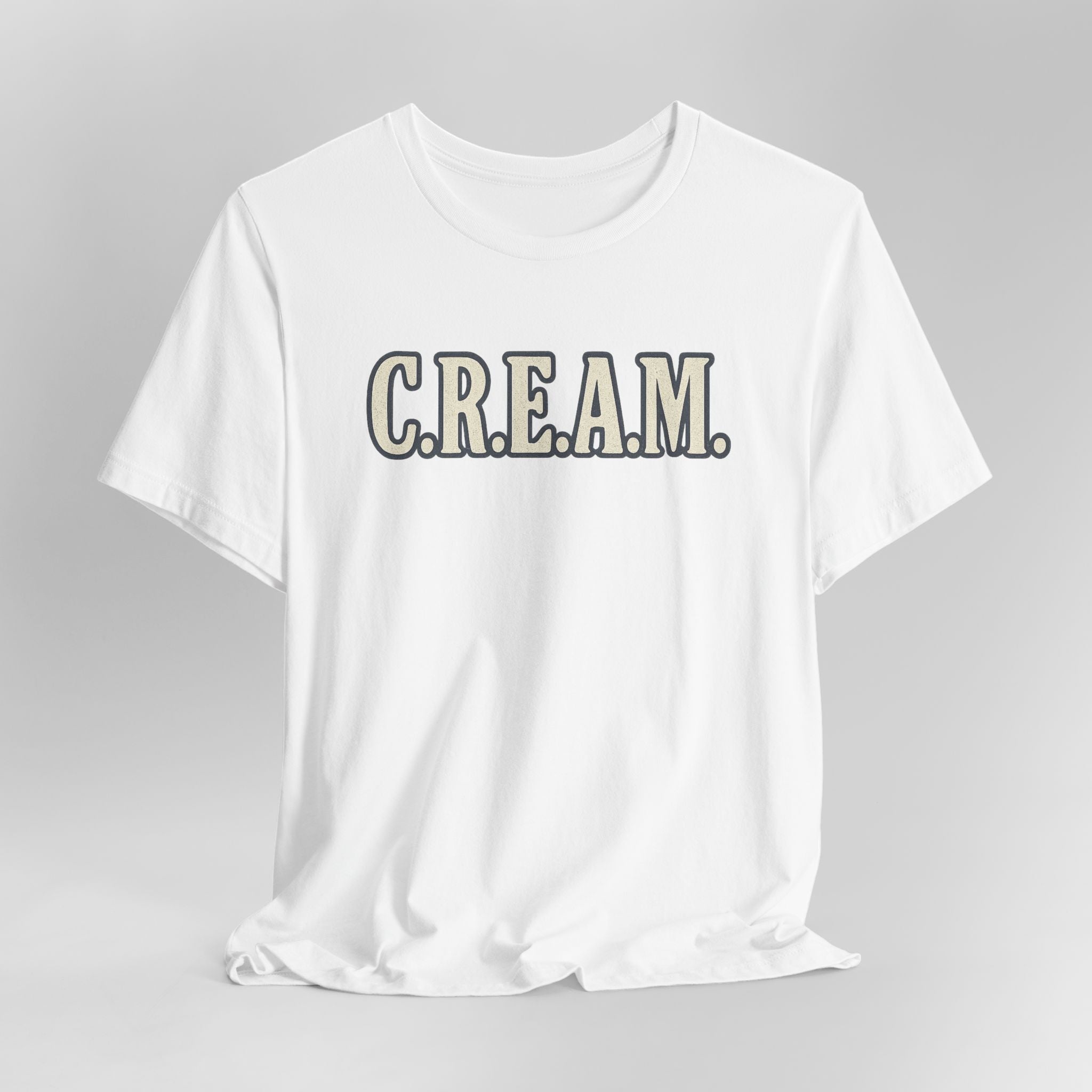 White t-shirt with 'C.R.E.A.M.' text on a gray background