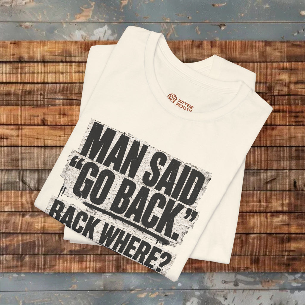 Beige t-shirt with text design on a wooden surface