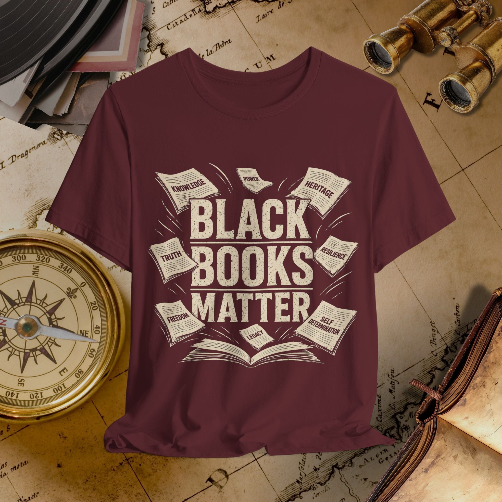 Maroon t-shirt with 'Black Books Matter' design on a vintage map background