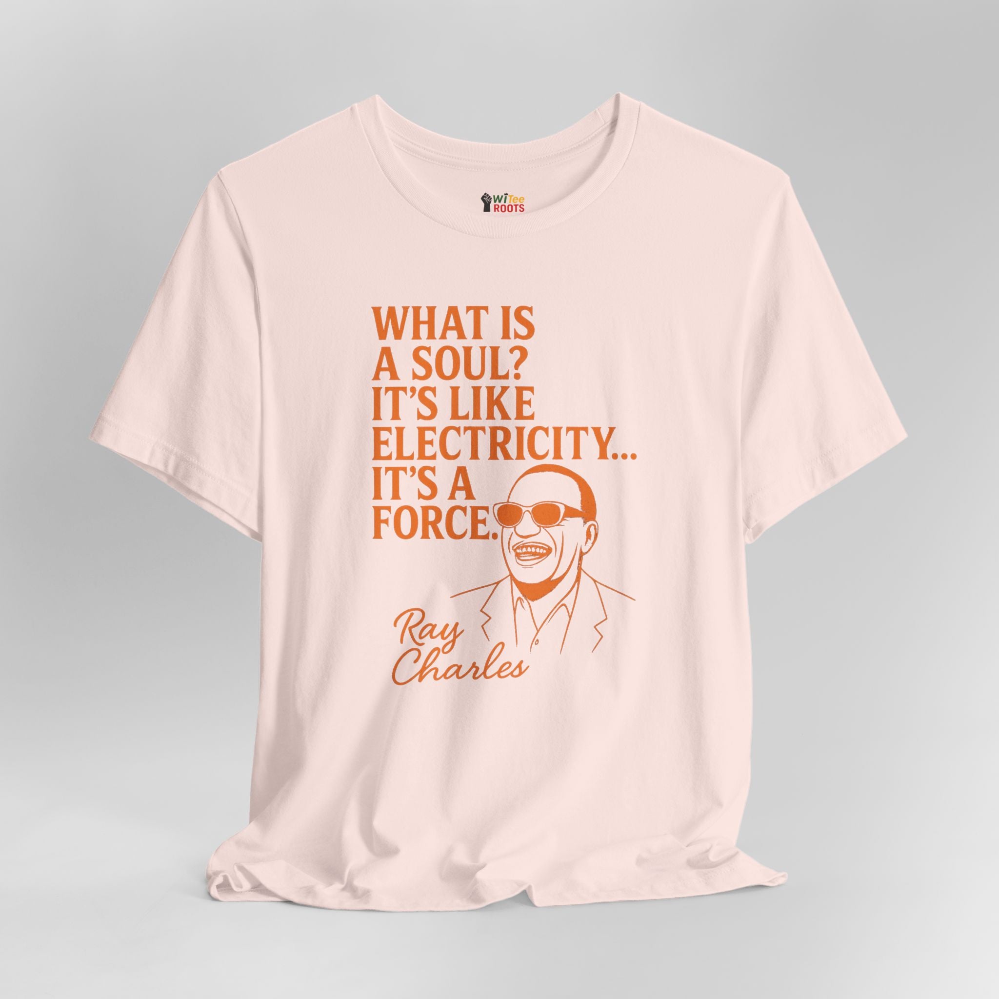 Pink t-shirt with Ray Charles quote on a gray background