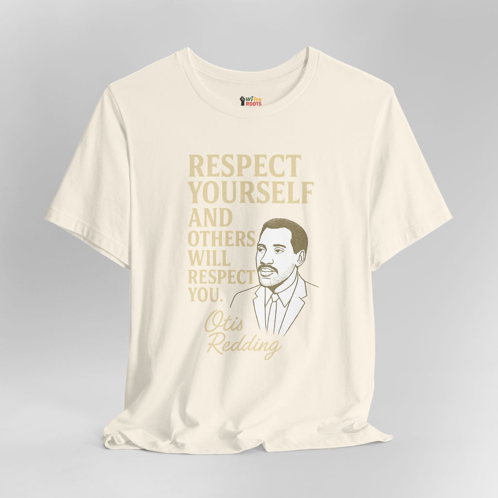 Beige t-shirt with gold text and a graphic of a man on a gray background