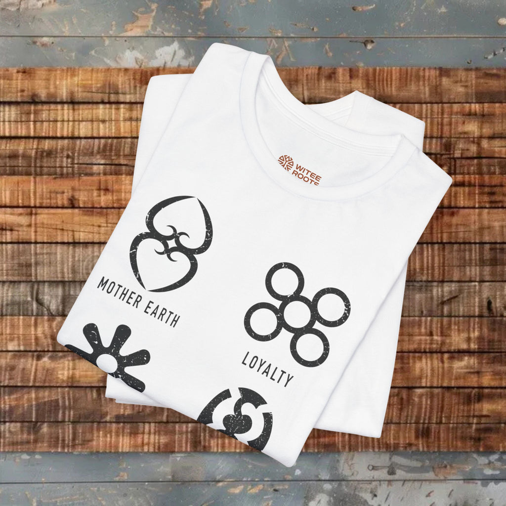White t-shirt with black graphics and text on a wooden surface