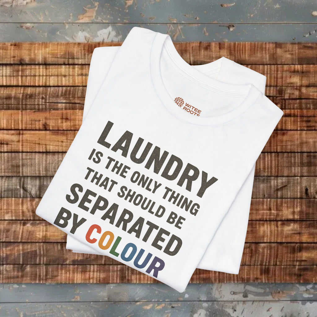 Folded white t-shirt with humorous text design on a gray background